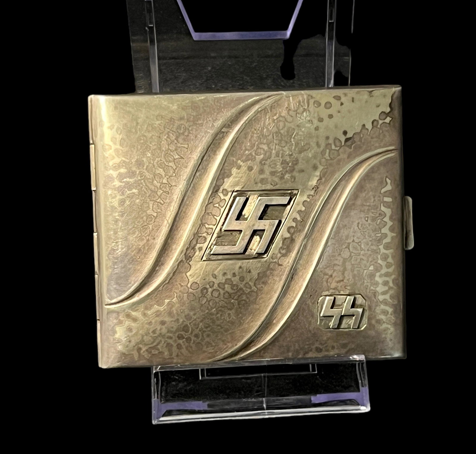 WWII Nazi German SS cigarette case: WWII Nazi German SS cigarette case 3 1/2" x 3". PLEASE NOTE: Los Angeles Estate Auction, as the seller of War memorabilia, would like to emphasize that these items are sold as historical artifacts and