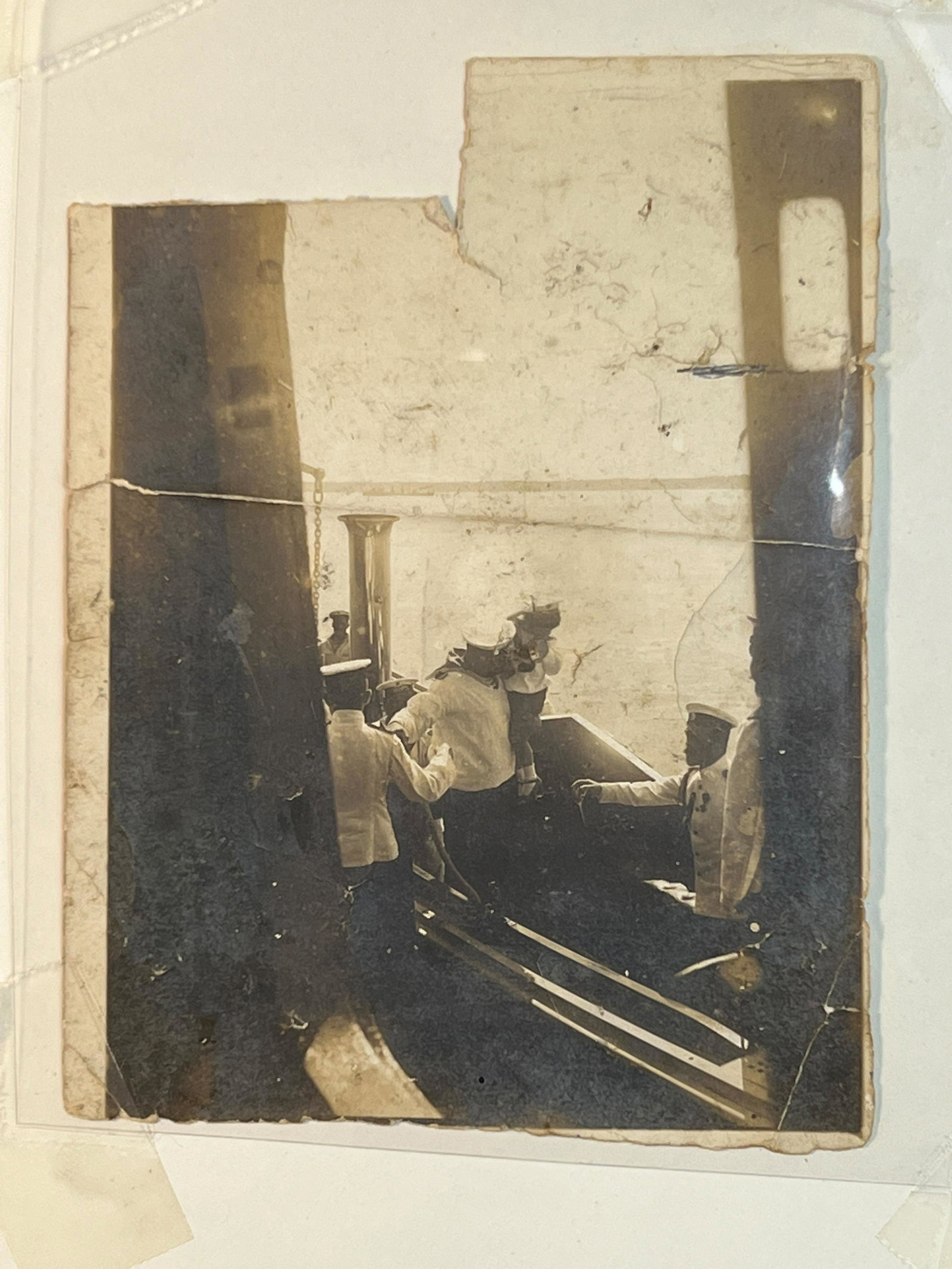 Antique Russian Photograph of Tzar Nicholas II with son: Antique Russian Photograph of Tzar Nicholas II with son, Tzar is on a boat the son is being handed to him. Size of item 8" x 10", photo 3 1/2" x 5"