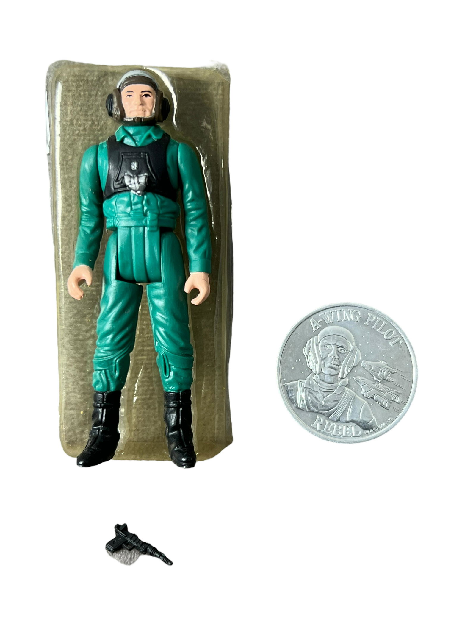 Star Wars power of the force Kenner a wing pilot 1984 with black laser pistol coin plastic inner: Star Wars power of the force Kenner a wing pilot 1984 with black laser pistol coin plastic inner shell action figure