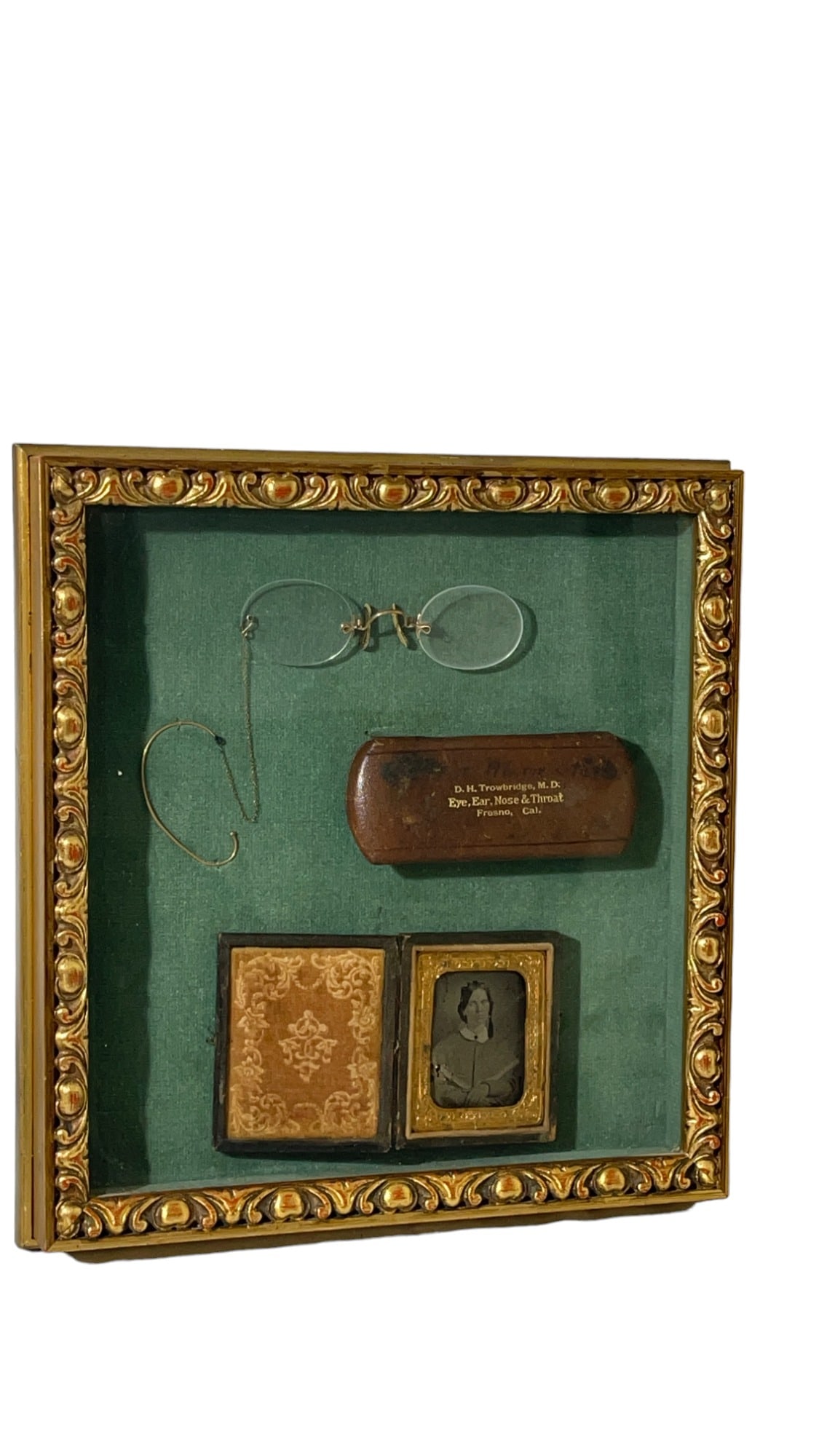 Display Case with Vintage Victorian Era Glasses, Case and Picture Case: Display Case with Vintage Victorian Era Glasses, Case and Picture Case. This display set belonged to D.H. Trowbridge, M.D. An Eye Ear Nose & Throat Doctor from Fresno, California