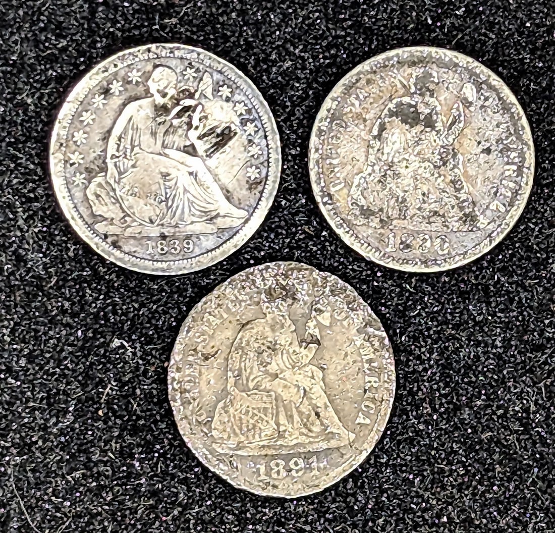 Three silver Seated Liberty dime coins (1 of 2)
