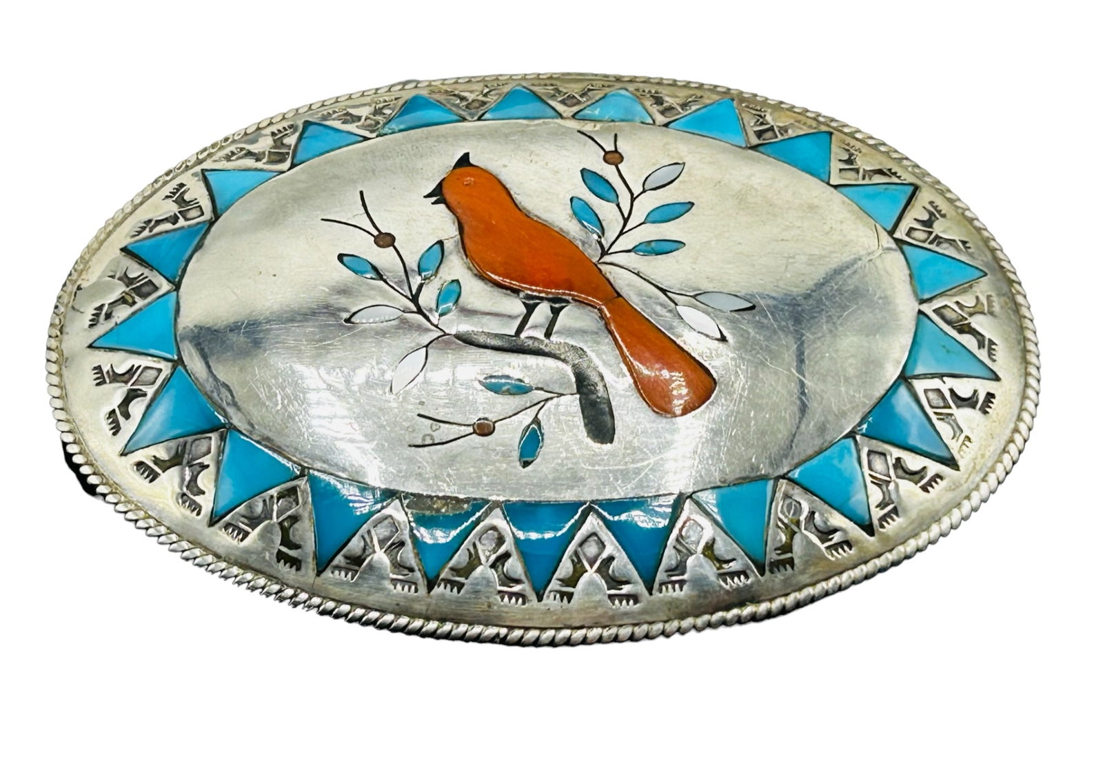 Silver Native American turquoise, and coral inlaid belt buckle: 59.10 grams 4" X 3 3/4" Scratch tested silver