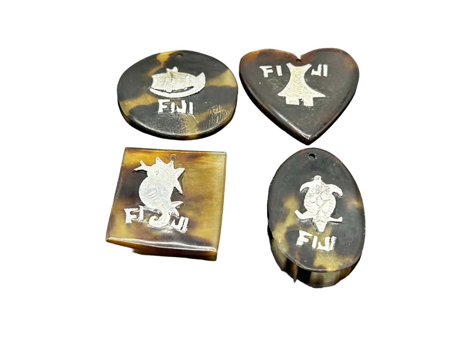 Four Fiji tortoise shell pendants: Four Fiji tortoise shell pendants