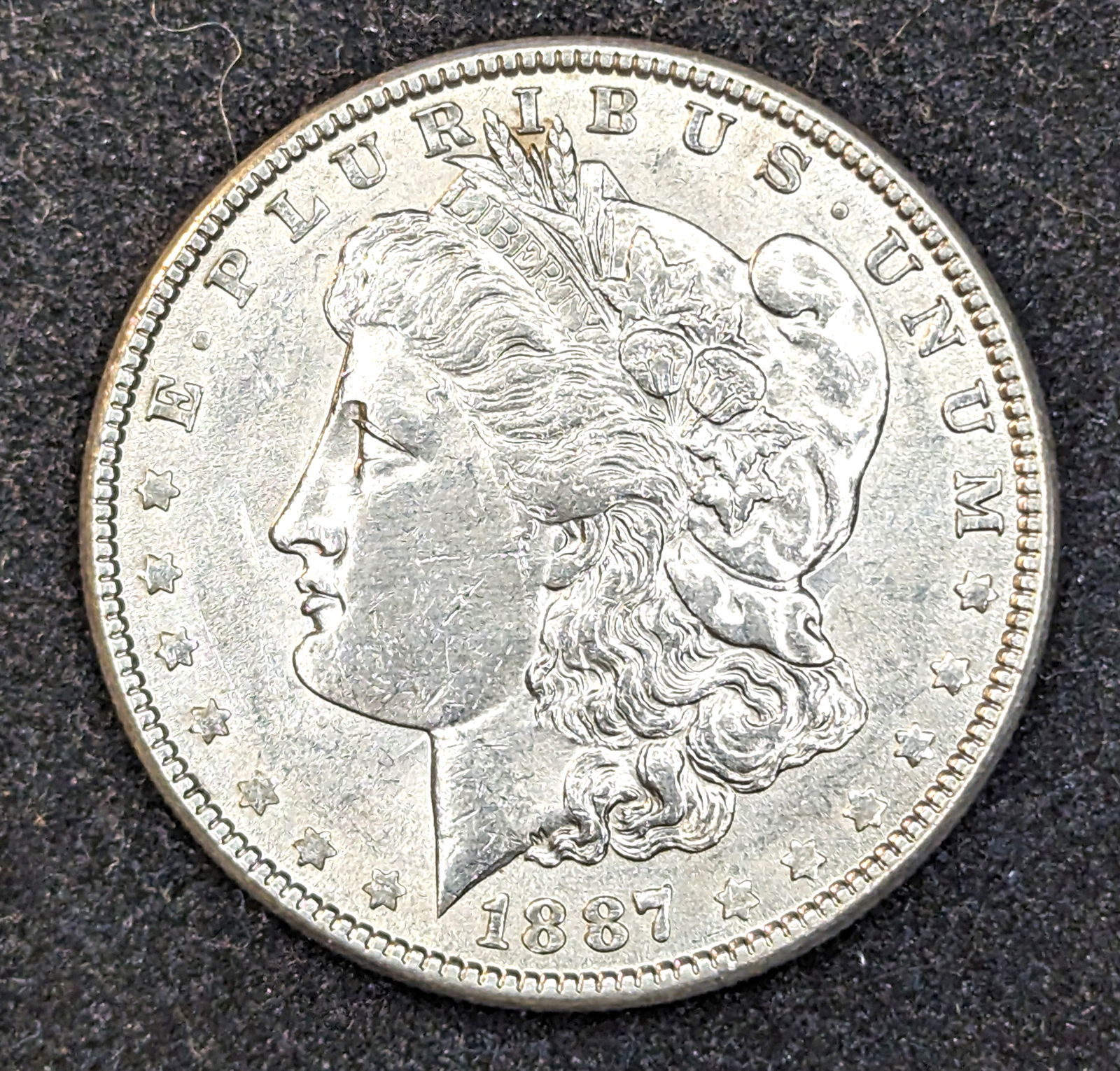 1887 Morgan Silver Dollar coin (1 of 2)