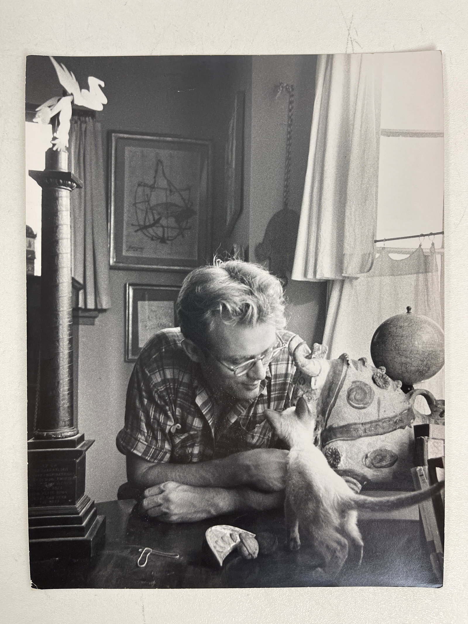 Sanford Roth - Photograph of James Dean with His Cat Stamped: Sanford Roth - Photograph of James Dean with His Cat Stamped on Verso. Size: 10 3/8" x 13.5". FROM A PRIVATE CALIFORNIA COLLECTION.