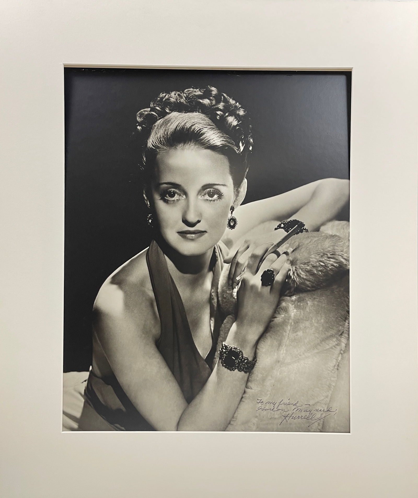 Bette Davis by George Hurrell Original Photograph Signed by Hurrell: Bette Davis by George Hurrell Original Photograph Signed by Hurrell. Signature reads "To My Friend Gordon Maynard, George Hurrell". Mounted to mat. Size: 26" x 30.5" framed.