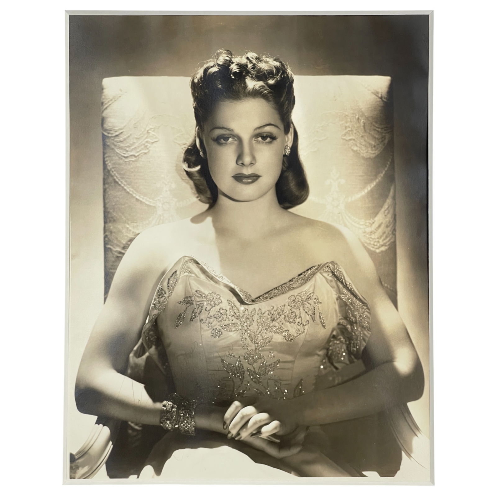 George Hurrell (1904-1992) - Ann Sheridon Silver Gelatin Photograph Stamped on Verso: George Hurrell (1904-1992) - Ann Sheridan Silver Gelatin Photograph Stamped on Verso. Faint signature and inscription by Ann Sheridan on the front of photograph. Size: 11" x 14".