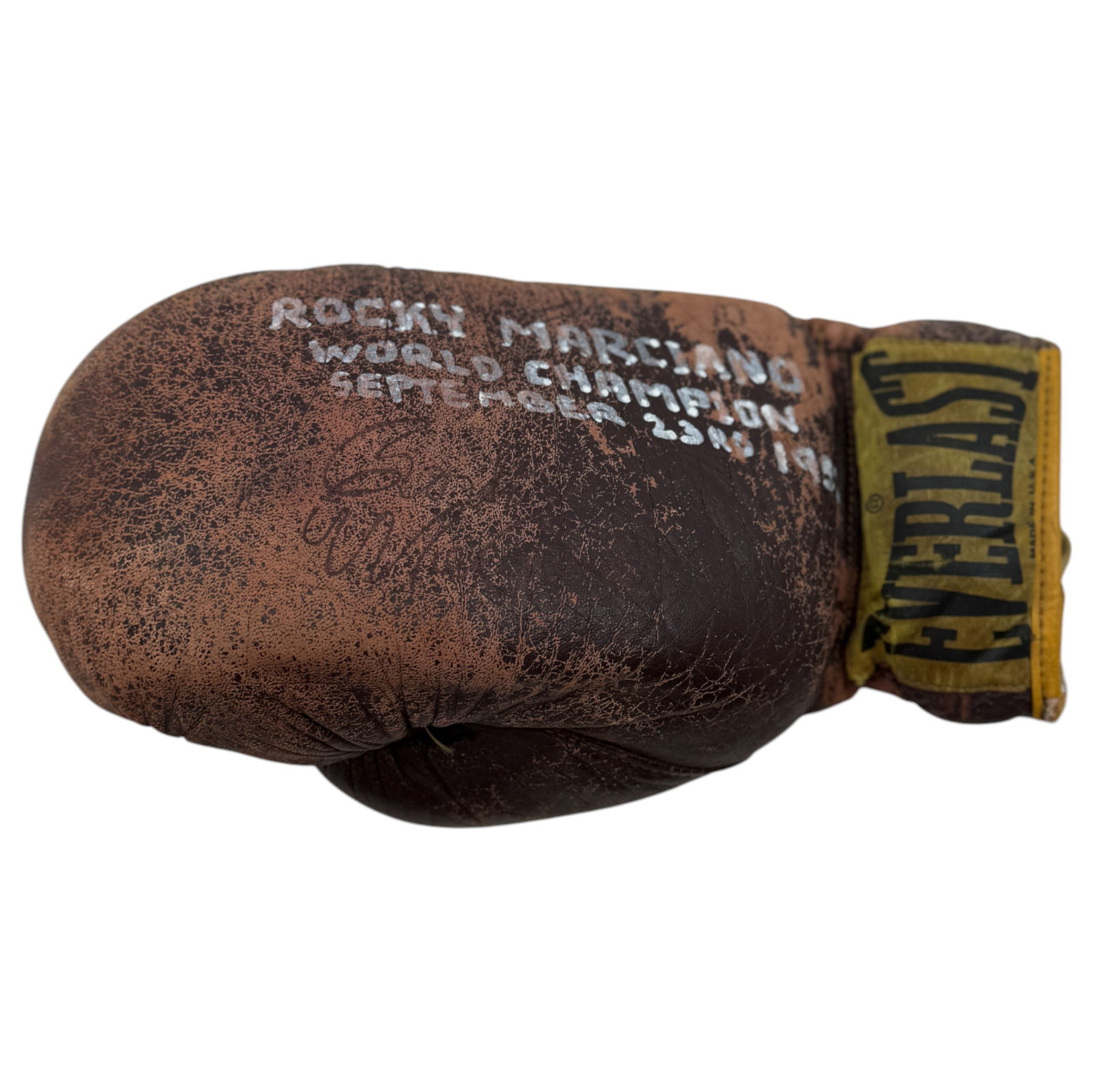 Signed Rocky Marciano Boxing Glove: Vintage Everlast glove signed with 'Rocky Marciano World Champion, September 23rd 1952'. Worn condition, rare collector’s item. This item has not been authenticated.
