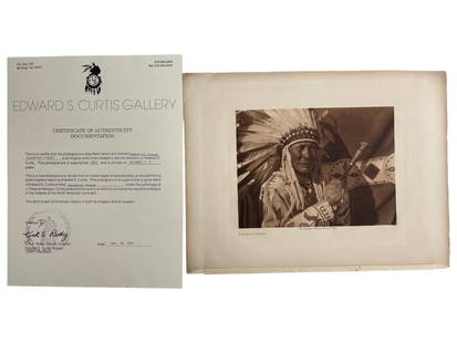 Edward Sheriff Curtis (1858-1952) - Blackfoot Finery 1926 Photogravure with Curtis Gallery COA: Edward Sheriff Curtis (1858-1952) - Blackfoot Finery 1926 Photogravure with Curtis Gallery COA. Printed on Holland V.G. paper. Size with frame: 13" x 12". Size of photogravure: 12 1/4" x 9 1/2".