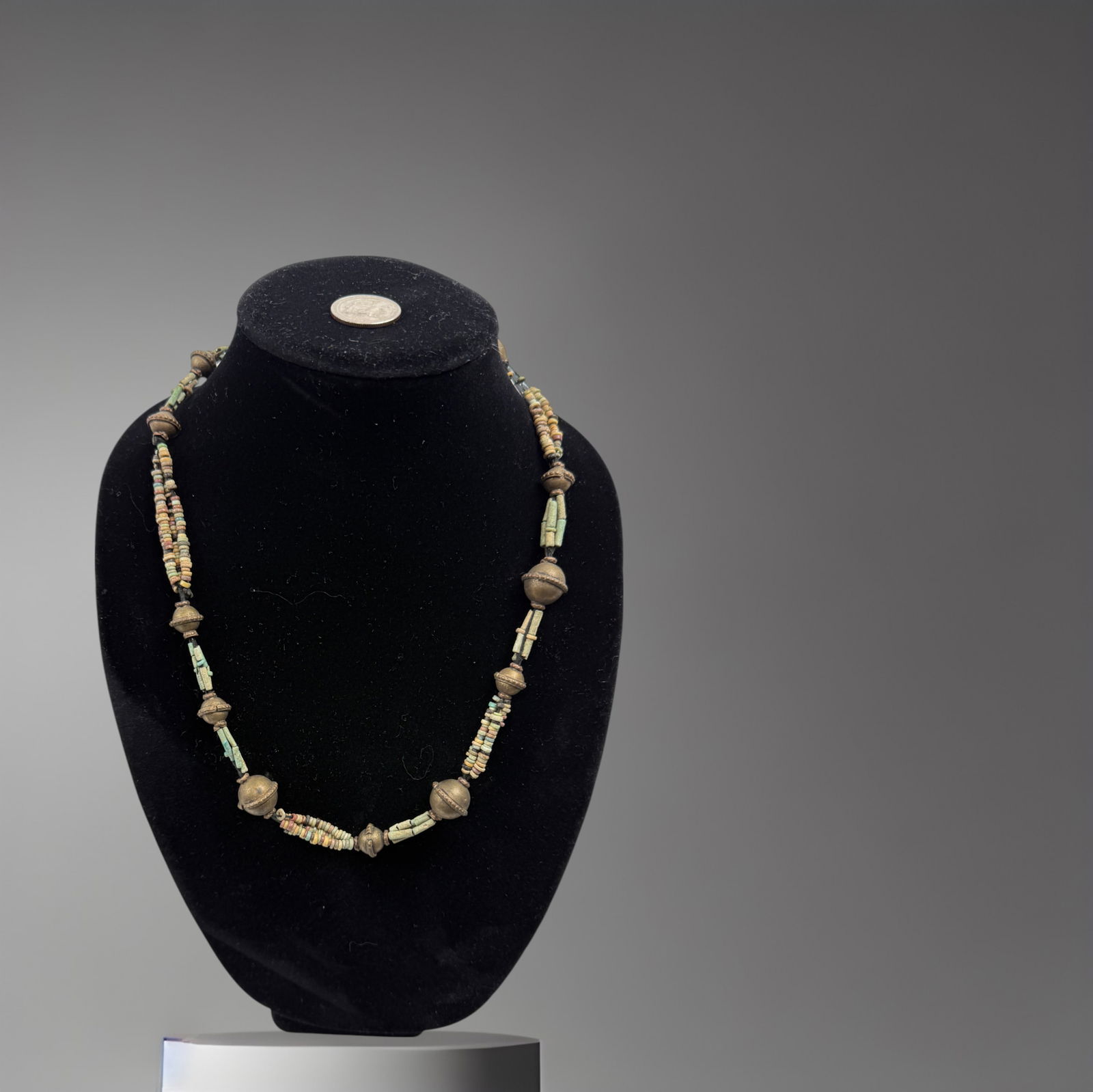 Egyptian Ancient faience and bronze bead necklace: An attractive ancient Egyptian bead necklace composed of alternating carnelian and faience beads, dating to approximately the Ptolemaic period (circa 3rd–1st century BC). The necklace features warm