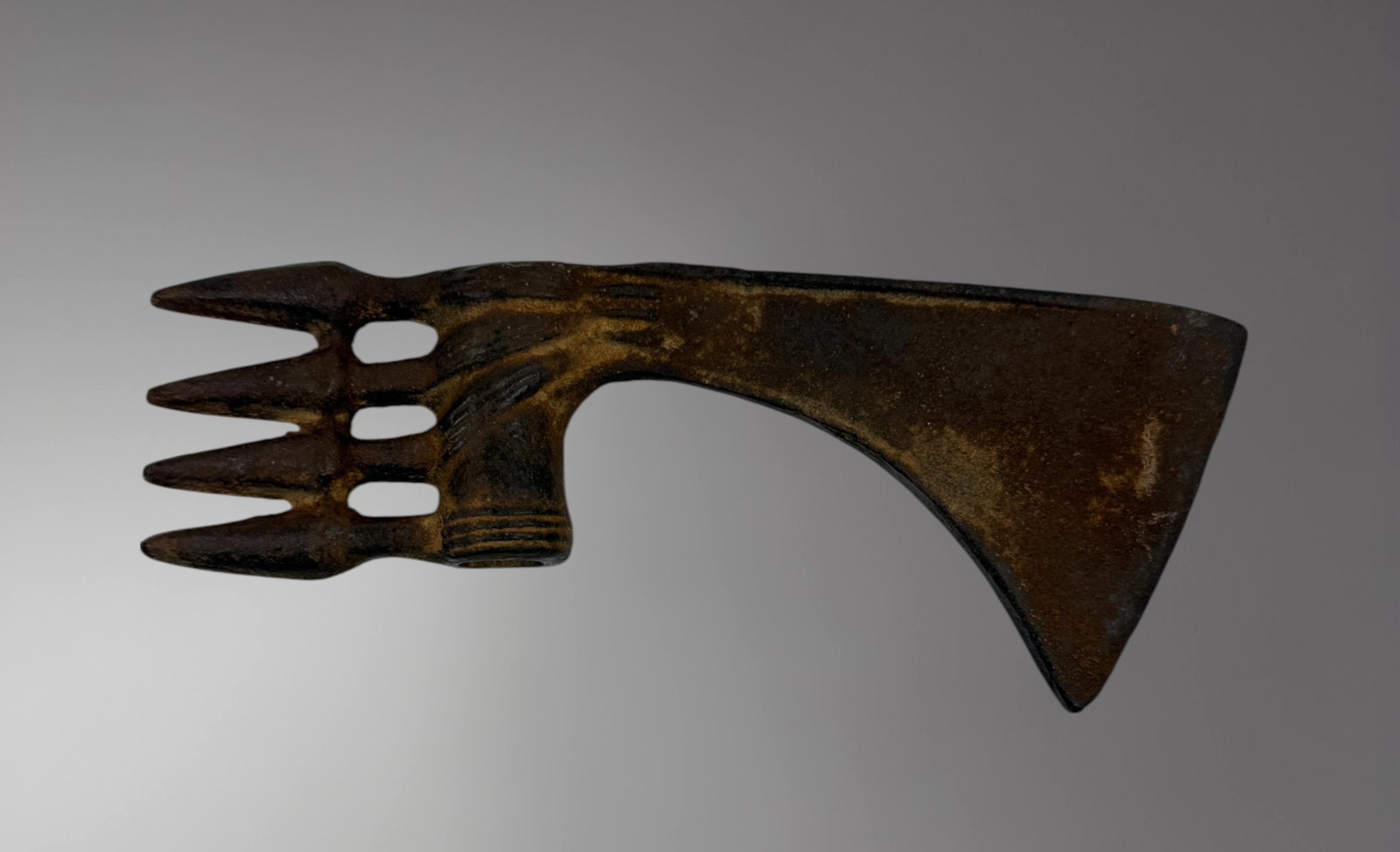 Smaller Luristan Bronze Axe – 2nd Century BC: A smaller Luristan bronze axe, dating to the 2nd century BC, cast in solid bronze with a slightly curved blade and a socketed shaft for haft attachment. Despite its compact size, the axe is finely bal