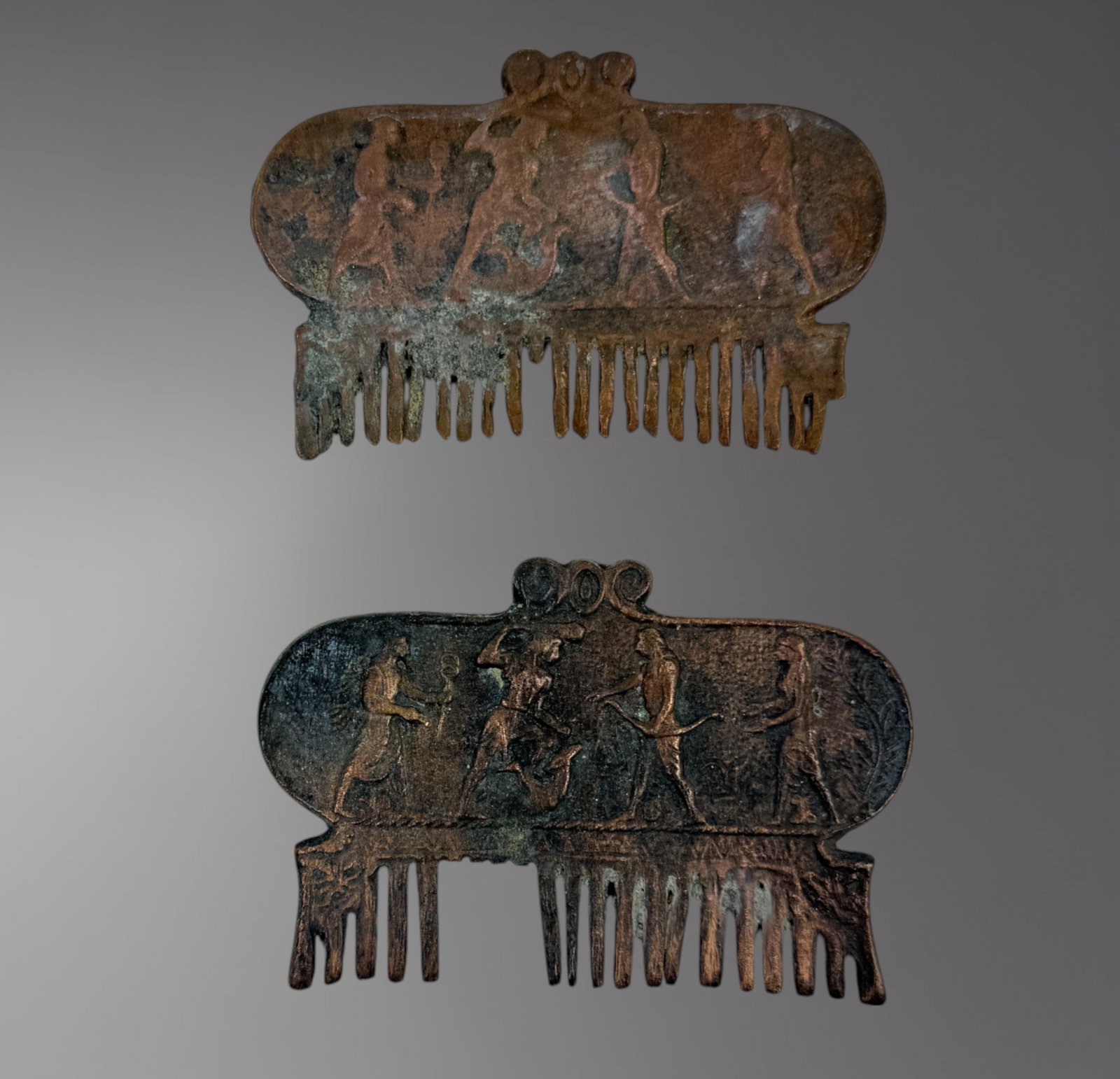 Pair of Luristan Bronze Combs – 2nd Century BC: A rare pair of Luristan bronze combs, dating to the 2nd century BC, each cast in a flat, rectangular form with fine, evenly spaced teeth. These grooming tools likely served both practical and symbolic