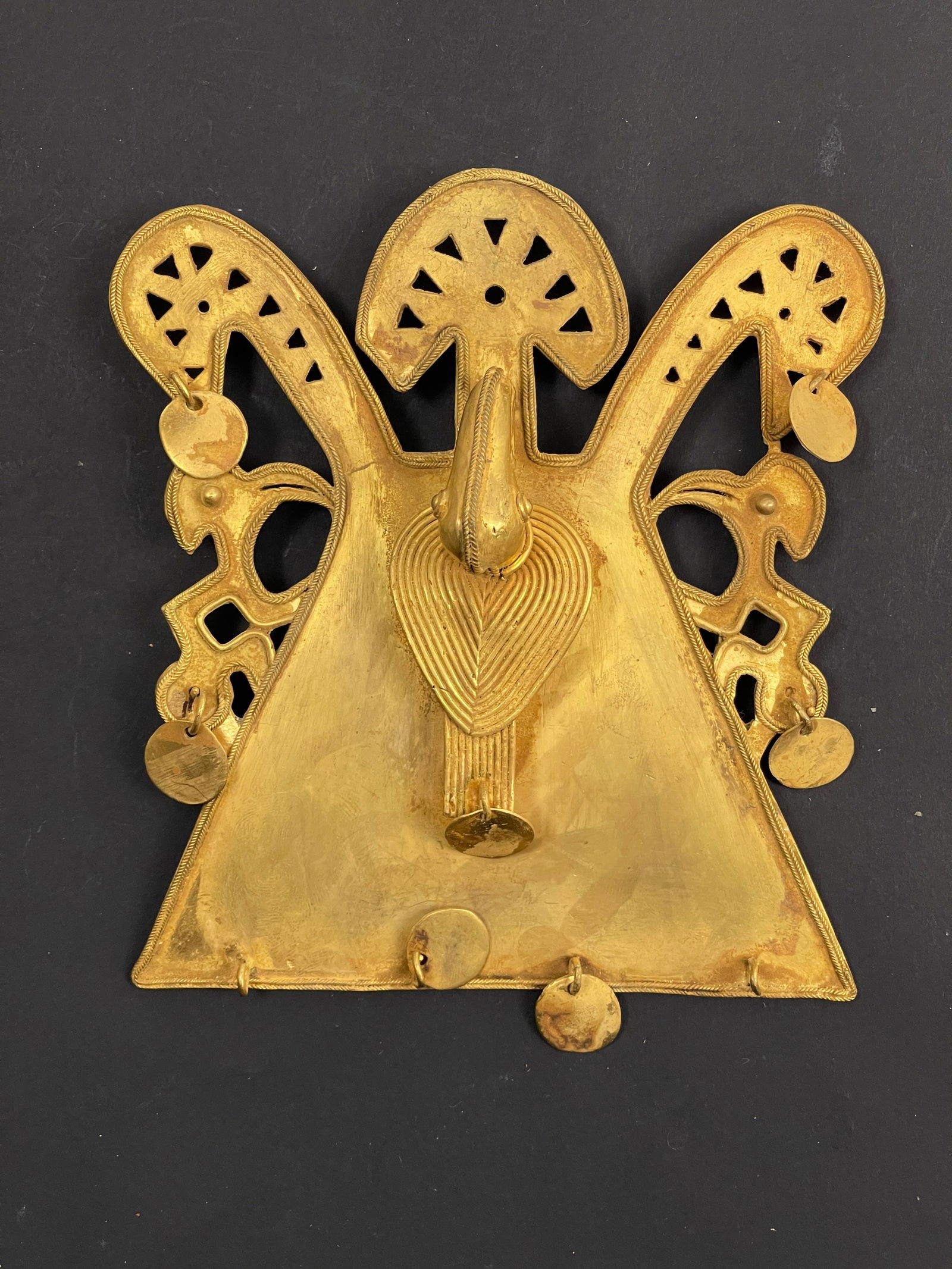 Ancient Pre-Columbian Mixed Metal Pendant Central or South America, circa 500–1200 CE: A rare and finely crafted Pre-Columbian pendant, made from a mixed-metal alloy, possibly a combination of copper, gold (tumbaga), or bronze, characteristic of early metallurgical traditions in ancient