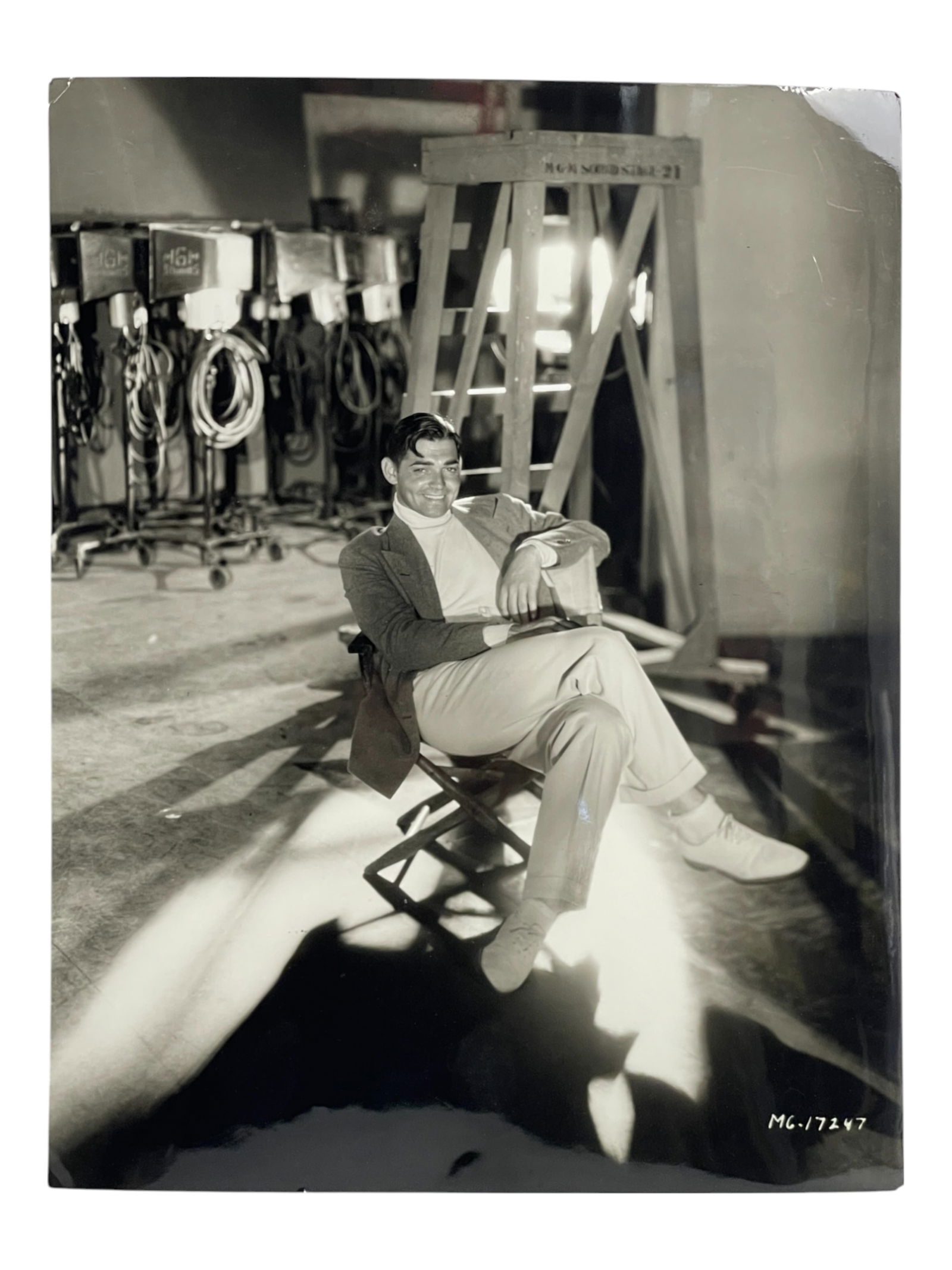 George Hurrell (1904-1992) 1931 Photoraph of Clark Cable on Studio Set: George Hurrell (1904-1992) 1931 Photoraph of Clark Cable on Studio Set. Hurrell Stamp on verso. Size: 14" x 11 1/2". Inscribed on verso.
