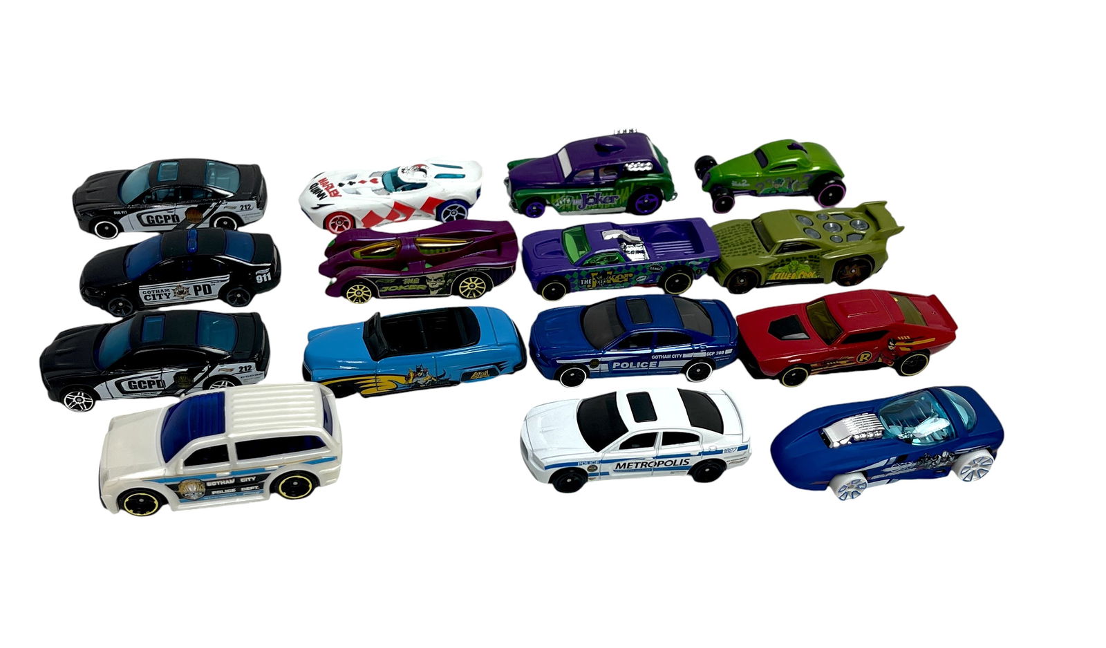 Collection of Die-Cast Toy Cars ? Hot Wheels & Matchbox: Group of 15 die-cast toy cars including Hot Wheels and Matchbox models, featuring police cars marked ?GCPD? and ?Metropolis,? a Batman-themed car, colorful fantasy racers in red, blue, purple, and gre