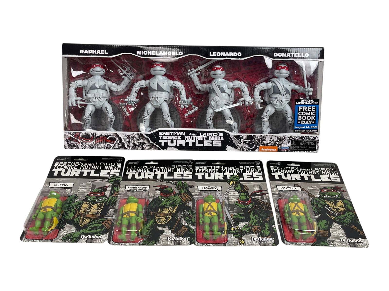 TMNT Eastman & Laird Figure Lot: Lot of Teenage Mutant Ninja Turtles collector figures including Eastman & Laird 4-pack and ReAction carded figures of Raphael, Leonardo, Michelangelo, and Donatello.