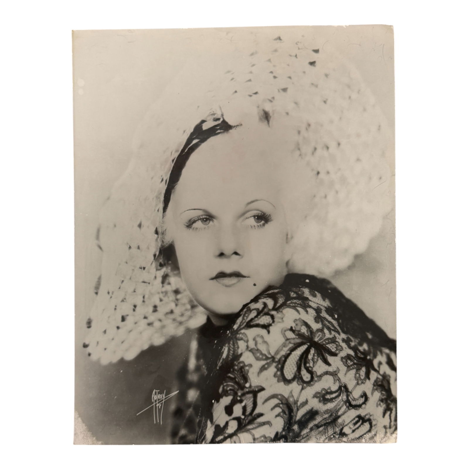 Hollywood Glamour Portrait - Jean Harlow: Large vintage black and white portrait of actress Jean Harlow wearing lace and hat. Classic studio photograph with signature mark. Unframed.