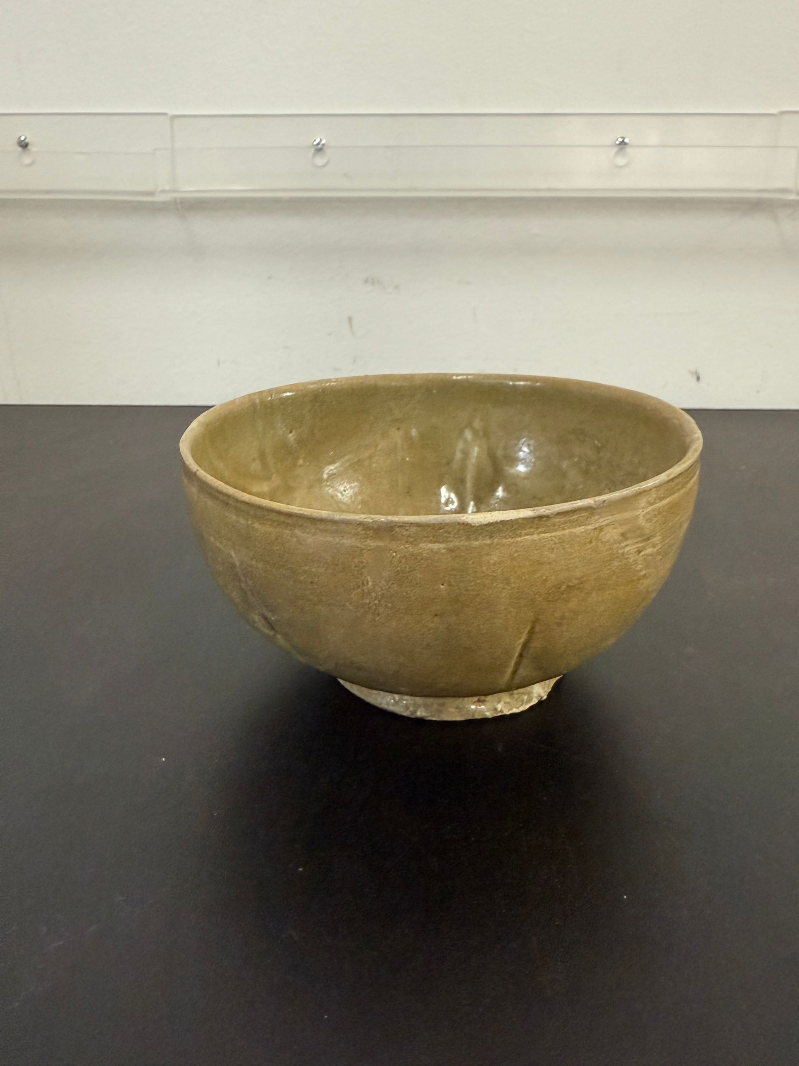 Antique Chinese Glazed Stoneware Bowl: Large antique hand-crafted glazed stoneware bowl with earthy glaze, likely 19th century. Rustic and collectible kitchenware.