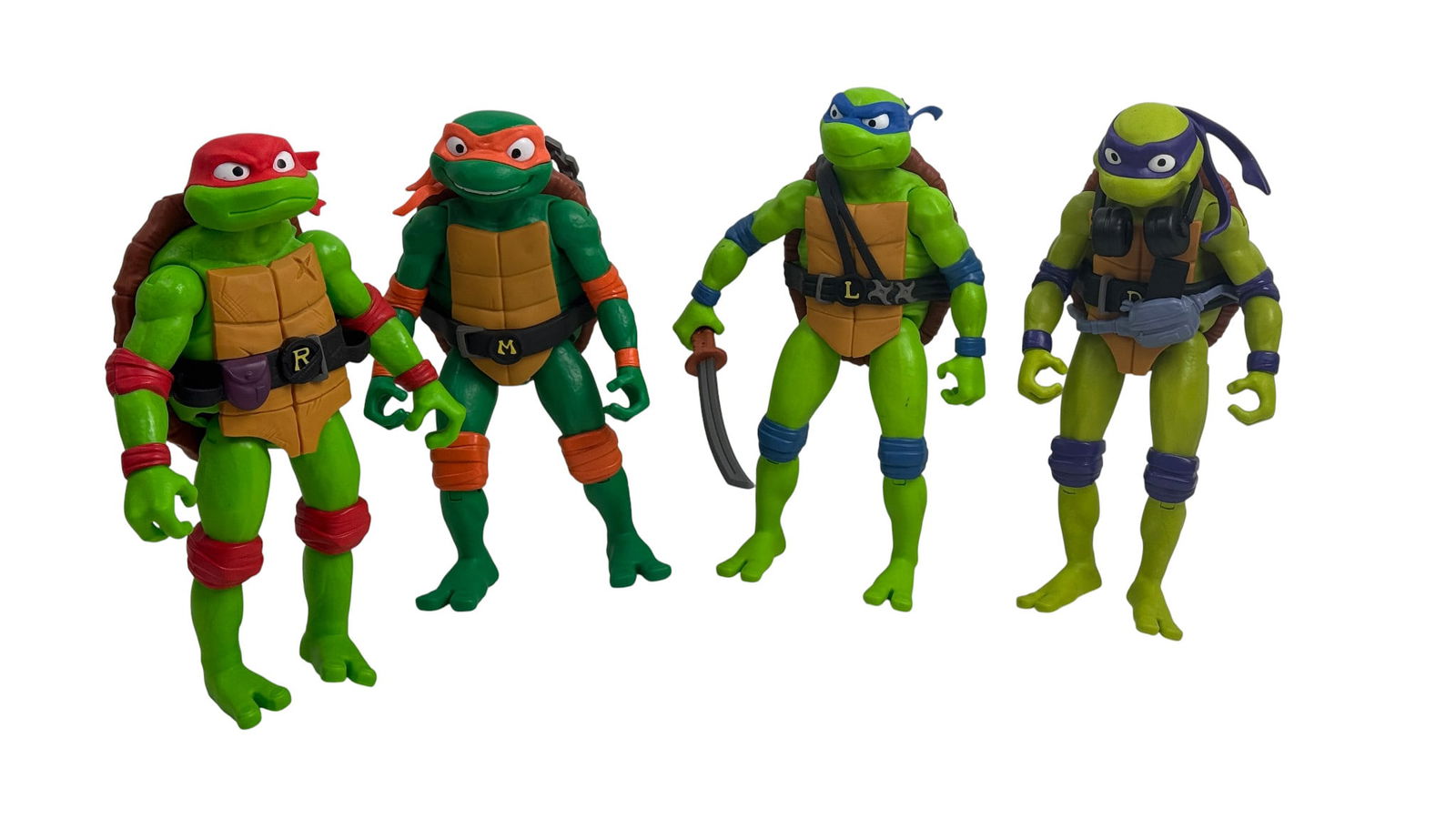Teenage Mutant Ninja Turtles Action Figures Loose Set of 4: Teenage Mutant Ninja Turtles loose action figure set of 4 including Leonardo, Donatello, Raphael, and Michelangelo.