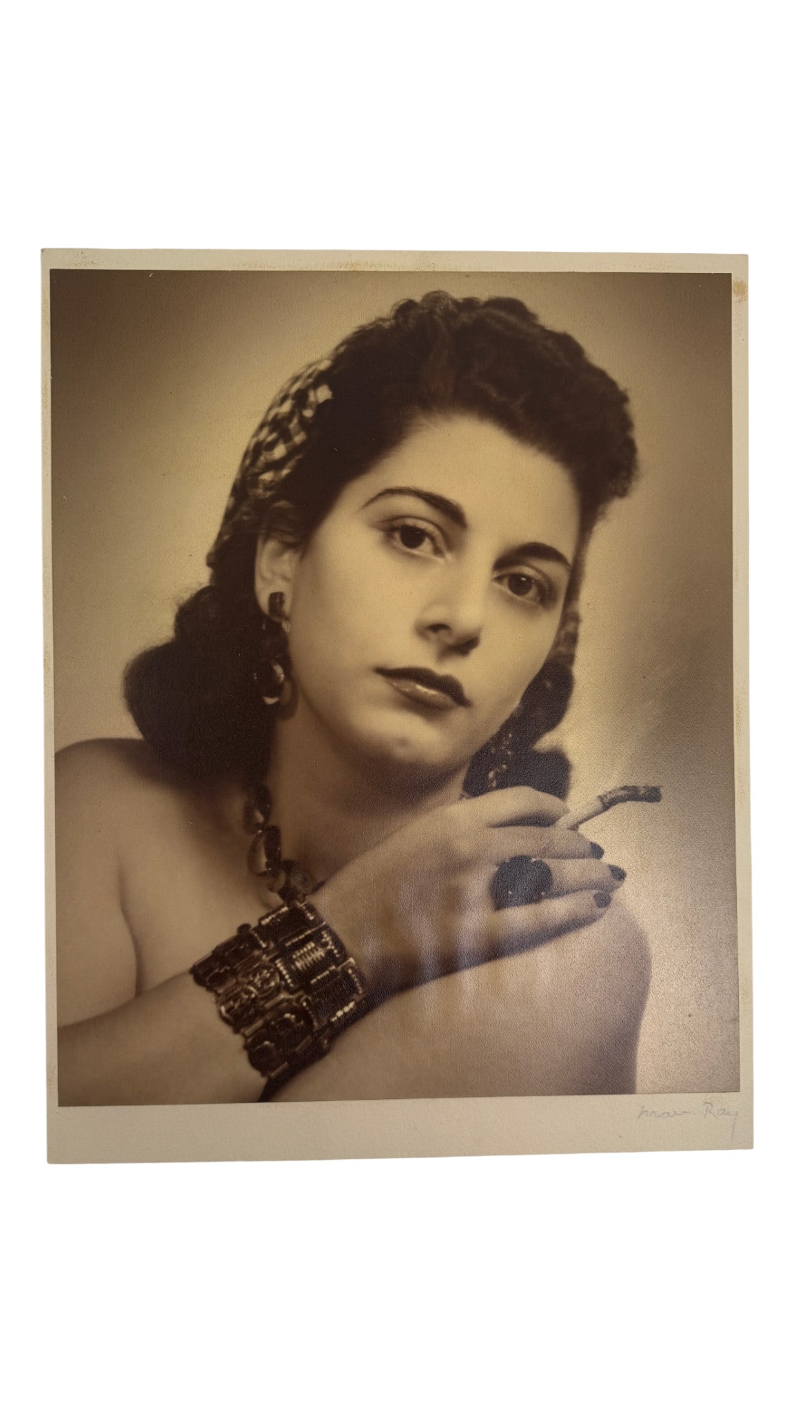 Man Ray Signed Photograph of Woman: Photograph of a woman smoking, signed lower right 'Man Ray'. Important surrealist artwork. Private collector item.