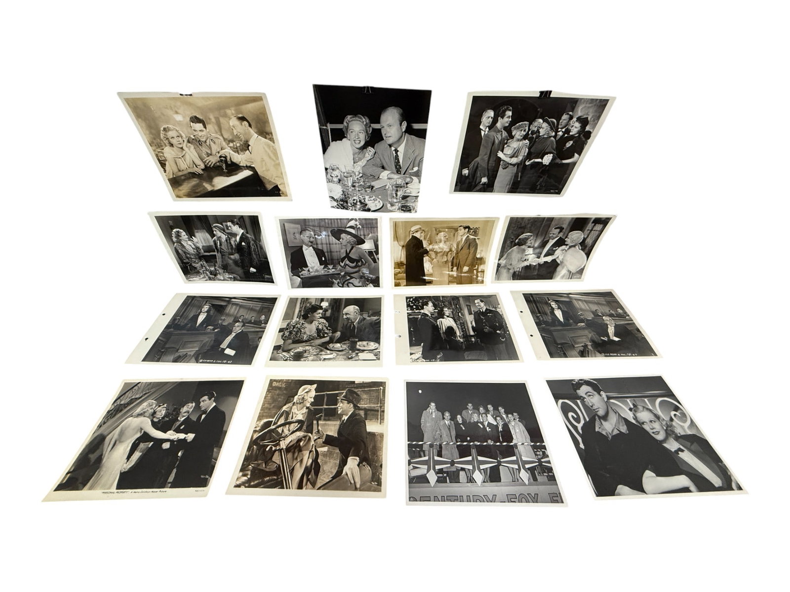 Vintage Hollywood Studio Photographs Lot (Approx. 15): Selection of approximately fifteen glossy black-and-white film stills showing various production and publicity scenes. Includes group and portrait compositions, mid-20th century.