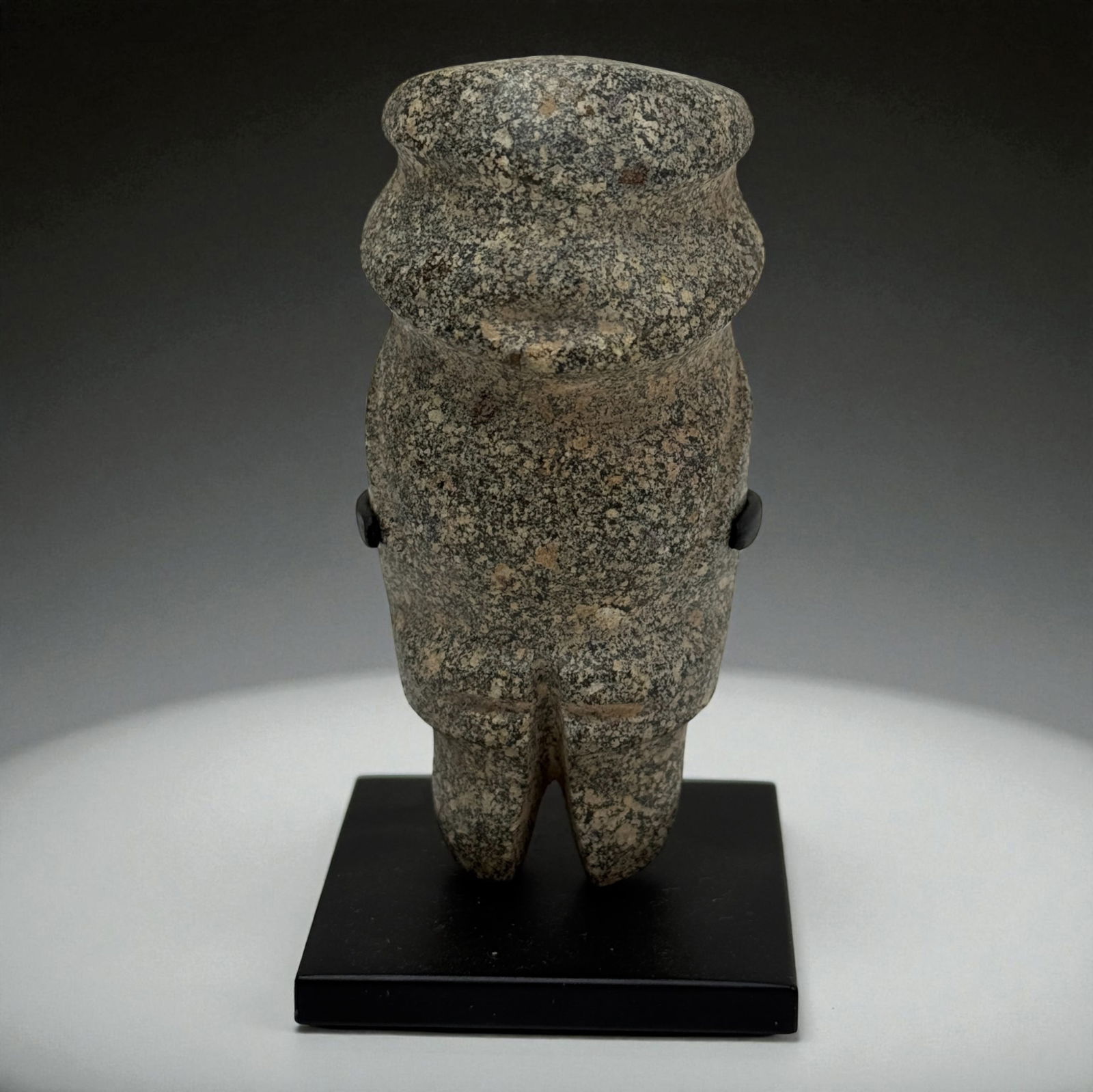 Pre Columbian Granite Anthropomorphic Figure: Granite carved standing figure with stylized facial structure and incised details. Provenance: Beverly Hills Barakat Gallery Collection.3 1/2" tall.