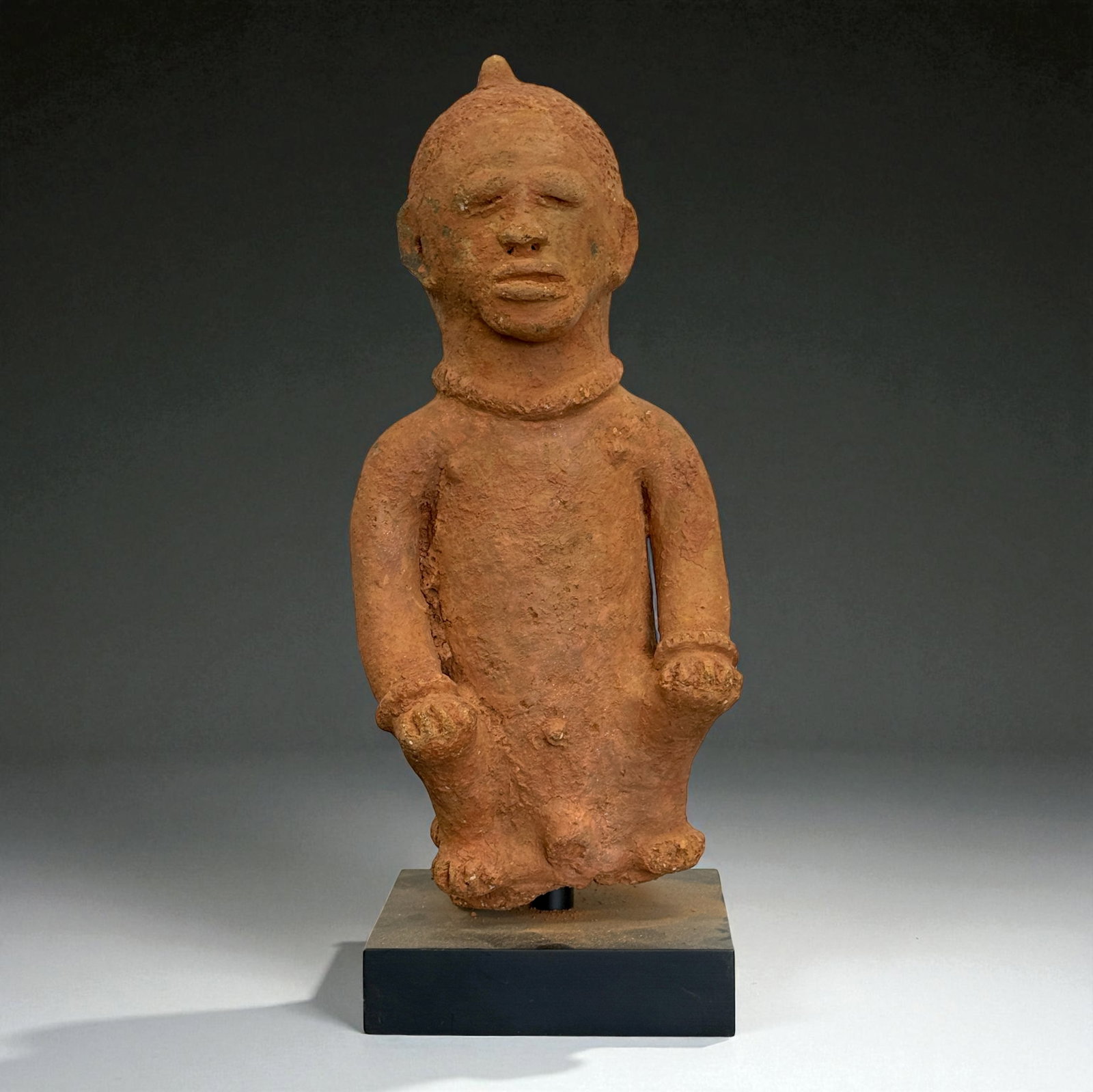 African Carved Male Figure: African Terracotta figure displaying traditional regional craftsmanship, likely 19th–20th Century. Provenance: Beverly Hills Barakat Gallery Collection. 14" inches