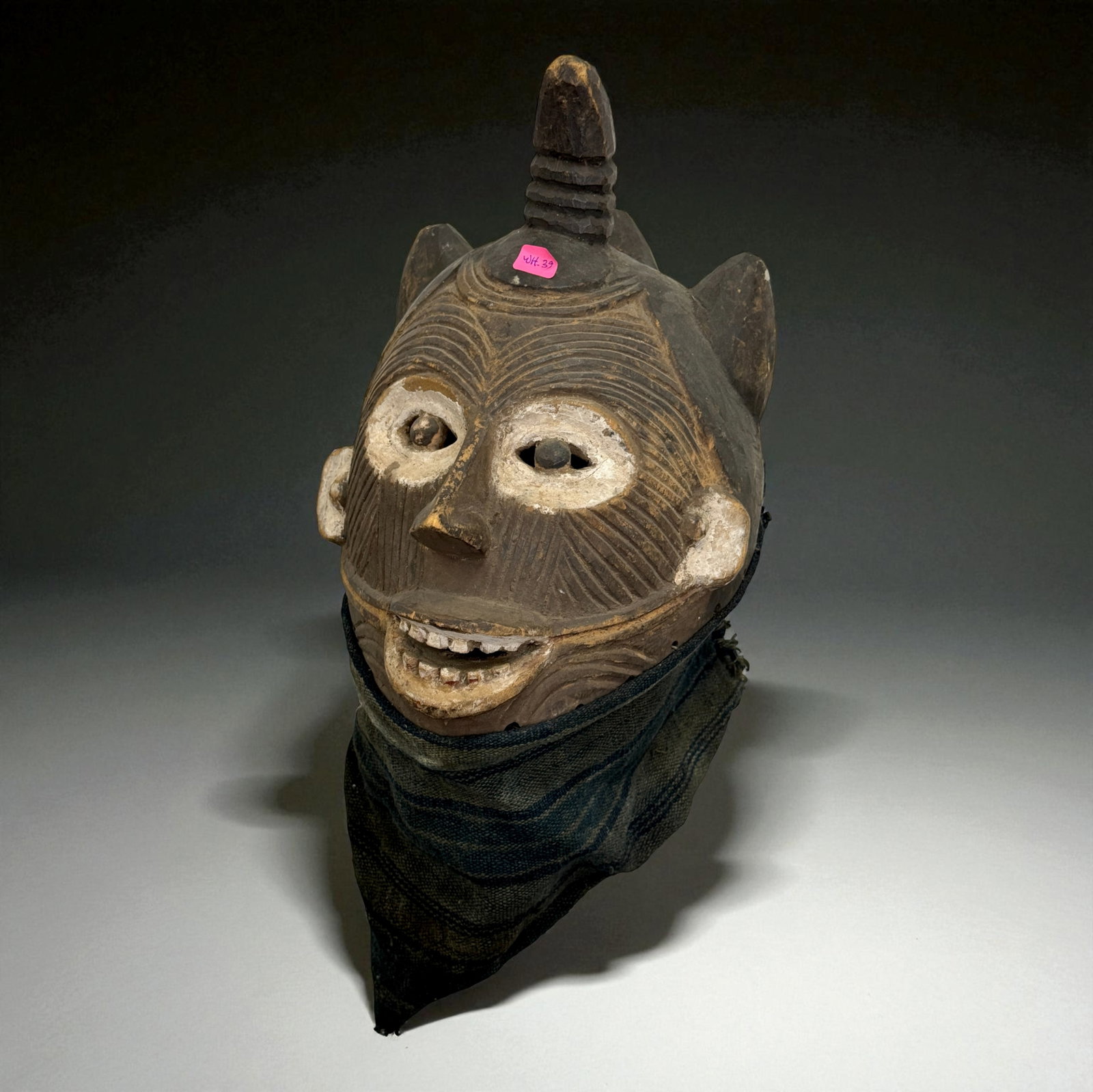 African Carved Mask: African carved wooden figure or mask displaying traditional regional craftsmanship, likely 19th–20th Century. Provenance: Beverly Hills Barakat Gallery Collection. 11" inches