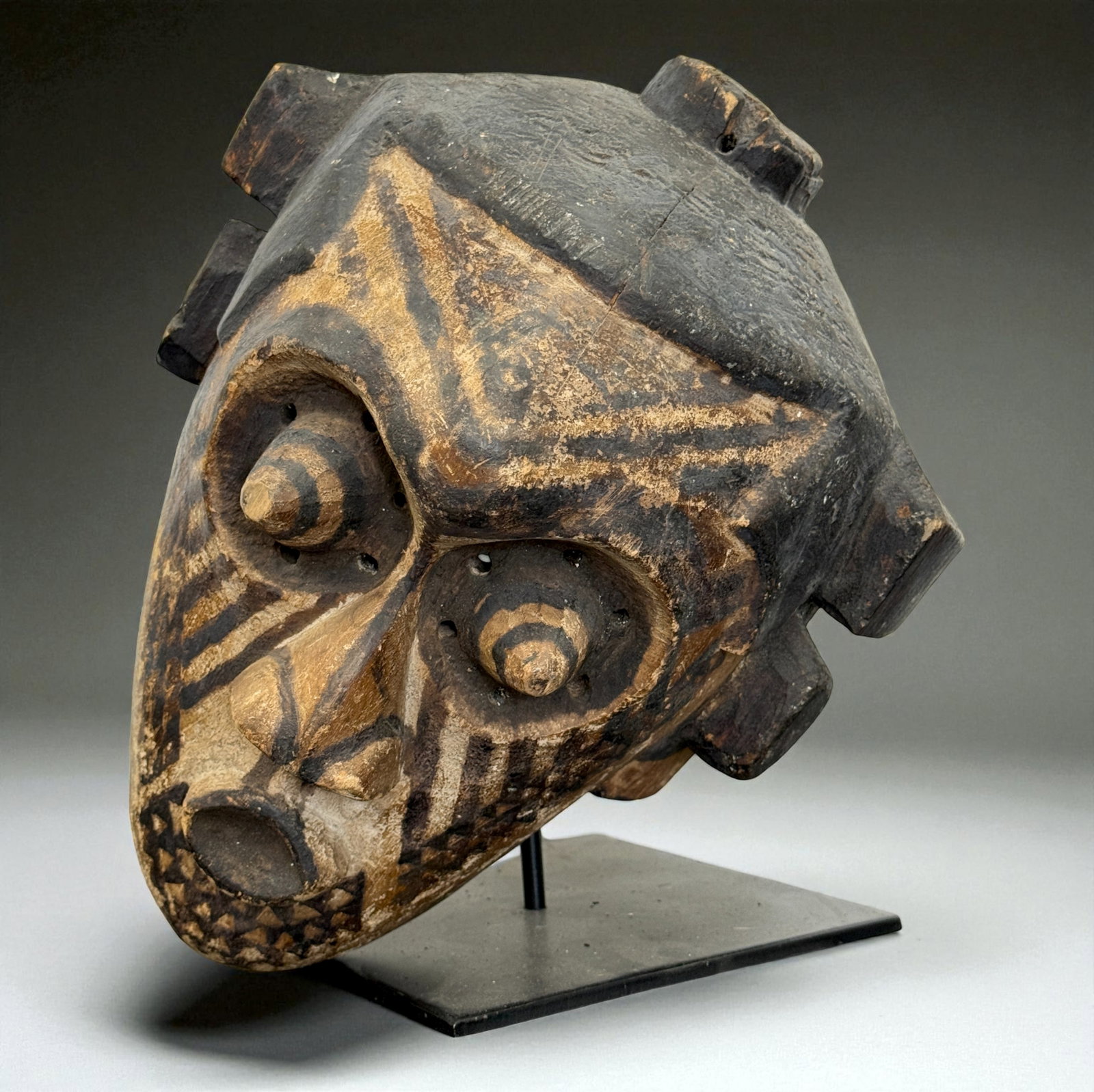 African Carved Mask: African carved wooden figure or mask displaying traditional regional craftsmanship, likely 19th–20th Century. Provenance: Beverly Hills Barakat Gallery Collection. 14" inches