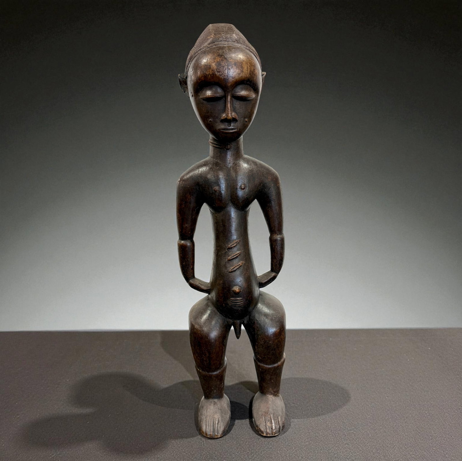Central African Ritual Guardian Figure: Central African Ritual Guardian Figure. Traditional carved form typical of 19th–20th Century regional African craftsmanship. Provenance: Beverly Hills Barakat Gallery Collection. 29" inches