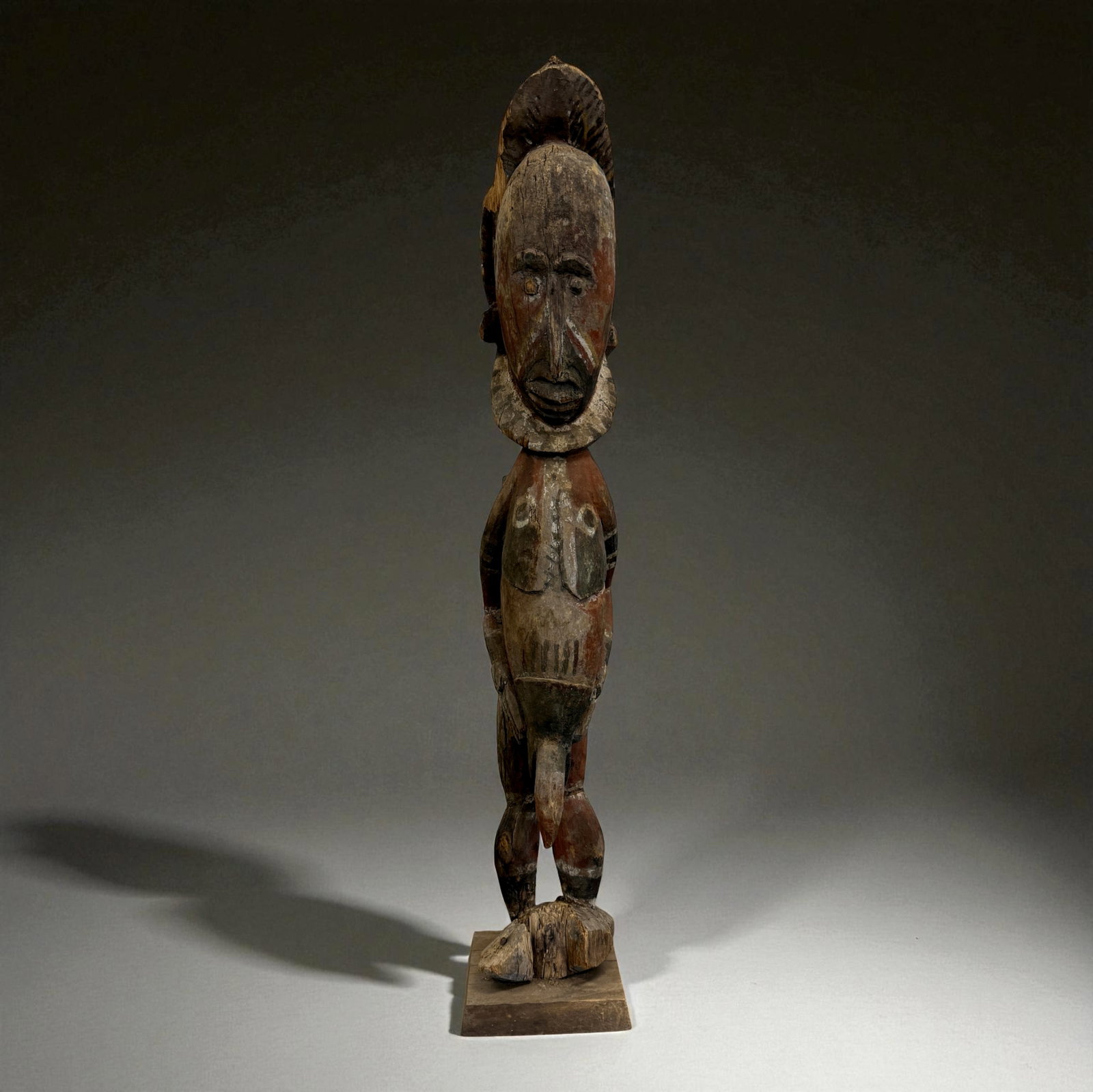West African Painted Tribal Figure: West African Painted Tribal Figure. Traditional carved form typical of 19th–20th Century regional African craftsmanship. Provenance: Beverly Hills Barakat Gallery Collection. 31" inches