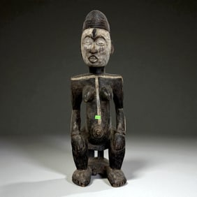 African Carved Female Figure with Pigment