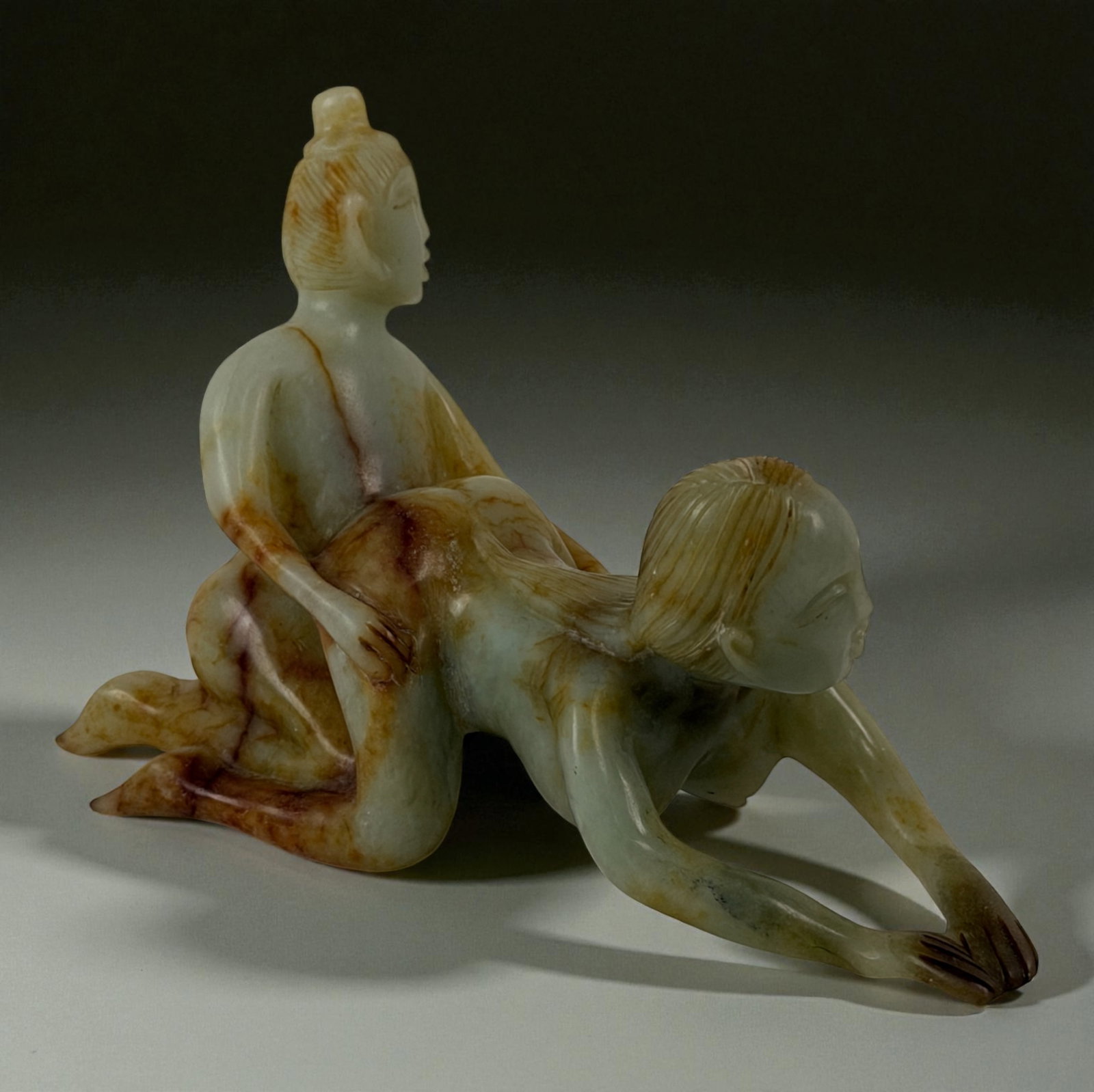 Chinese Carved Jade Erotic Group: Carved jade erotic figural group with mottled coloration.Provenance: Beverly Hills Barakat Gallery Collection. 5"