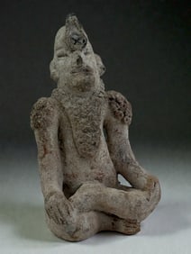 Seated Figure with Tall Headdress