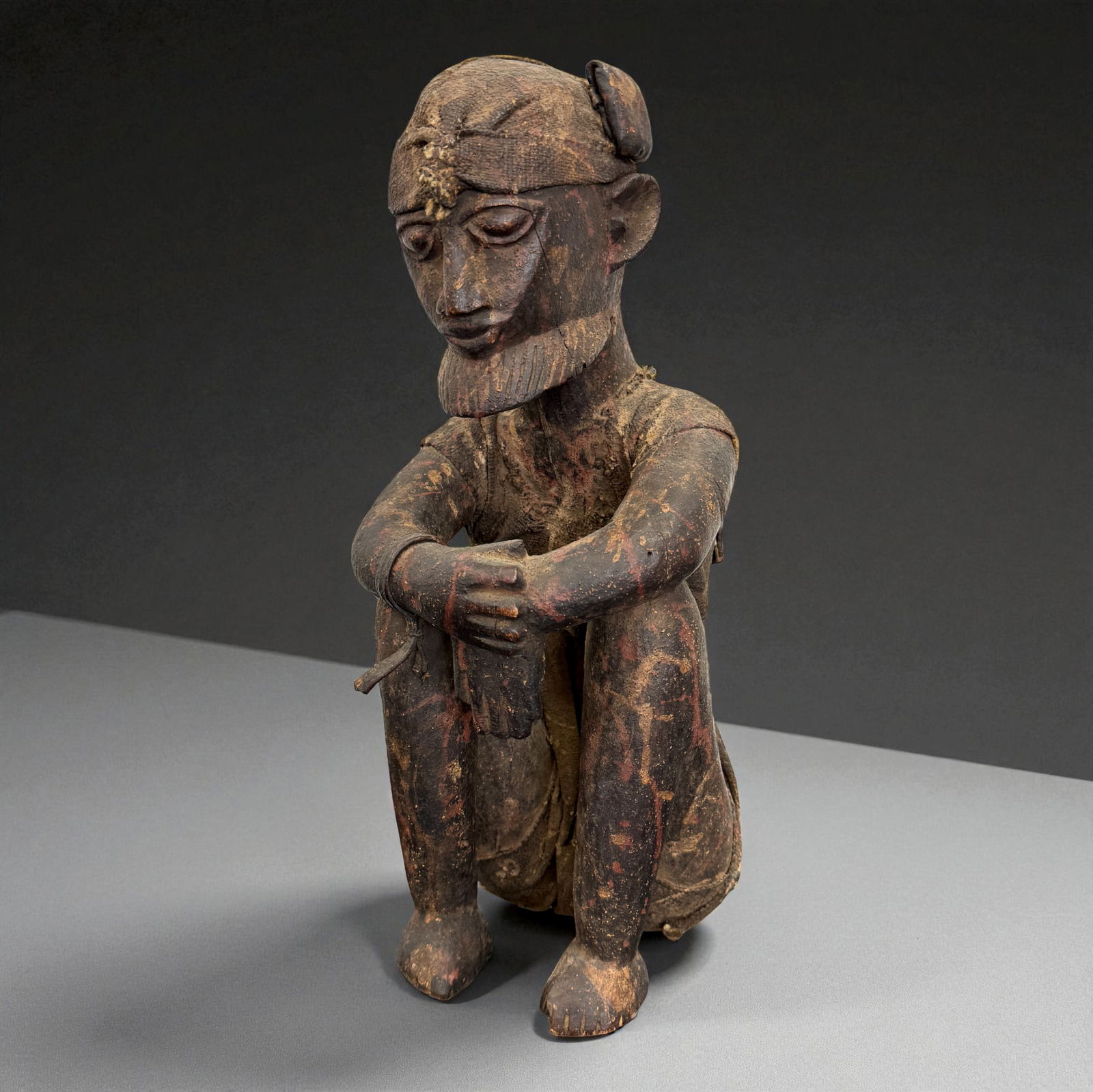 African Carved Male Figure: African carved wooden figure or mask displaying traditional regional craftsmanship, likely 19th?20th Century. Provenance: Beverly Hills Barakat Gallery Collection. 17" inches