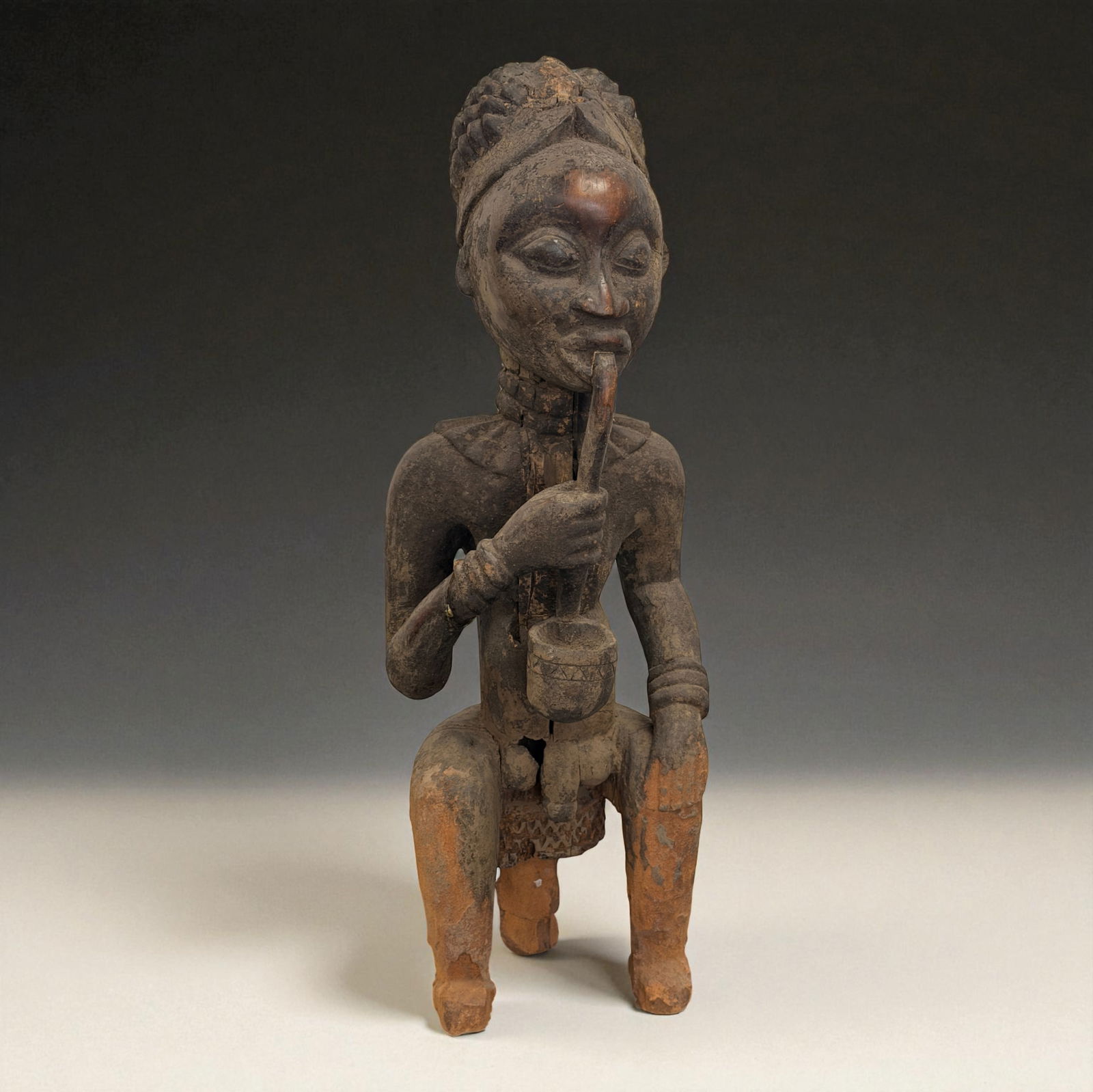 African Seated Figure with Pipe (1 of 9)