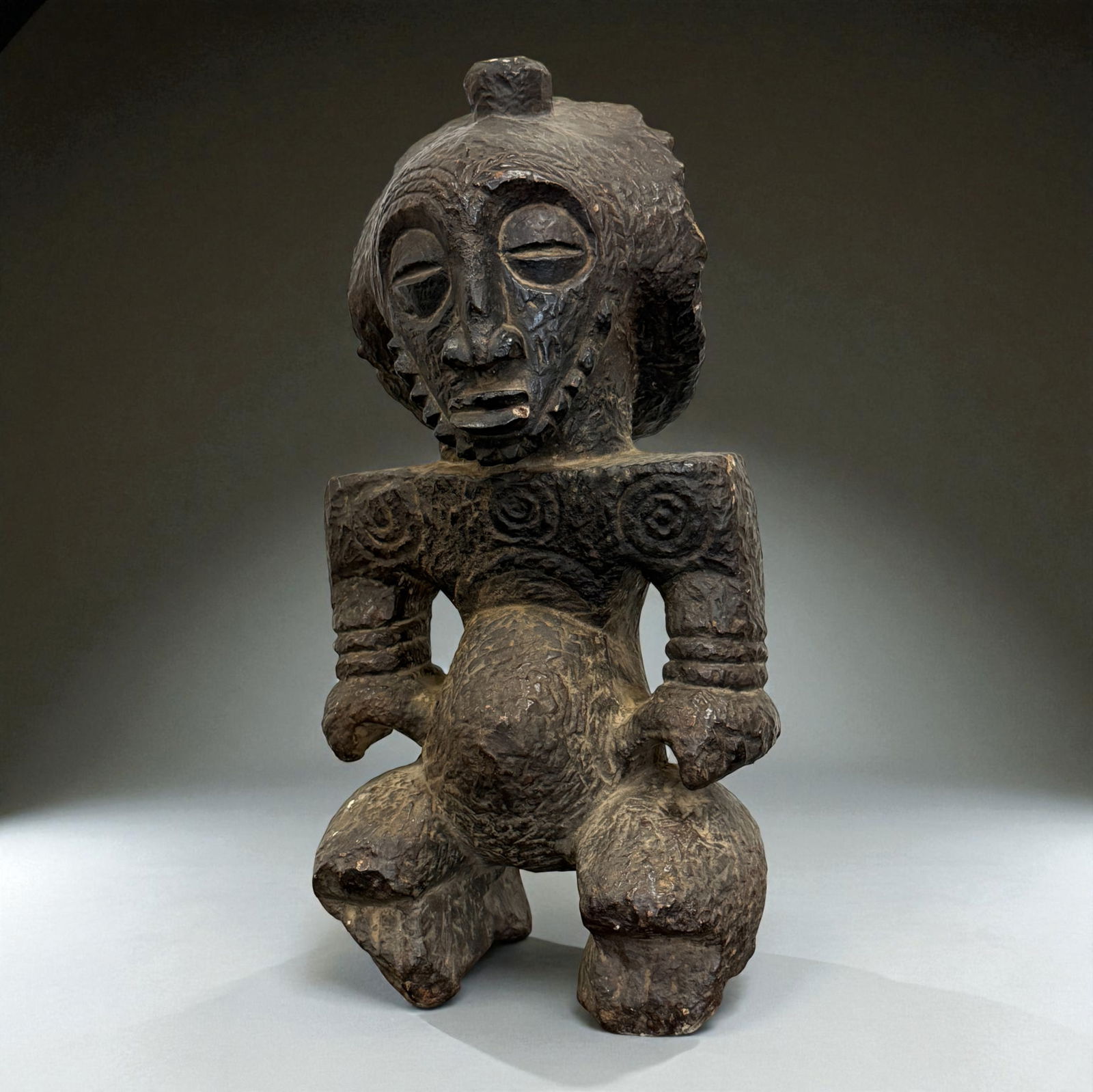 African Carved Seated Figure with Textured Surface (1 of 8)