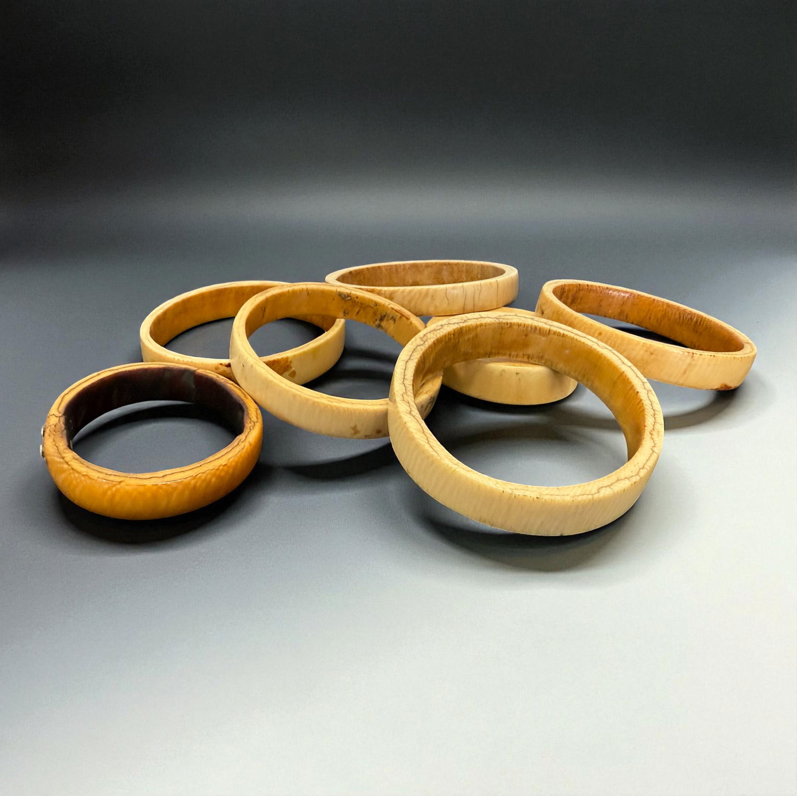 Antique African Bangles Set: Group of vintage bone bangles in natural varied tones.Provenance: Beverly Hills Barakat Gallery Collection.