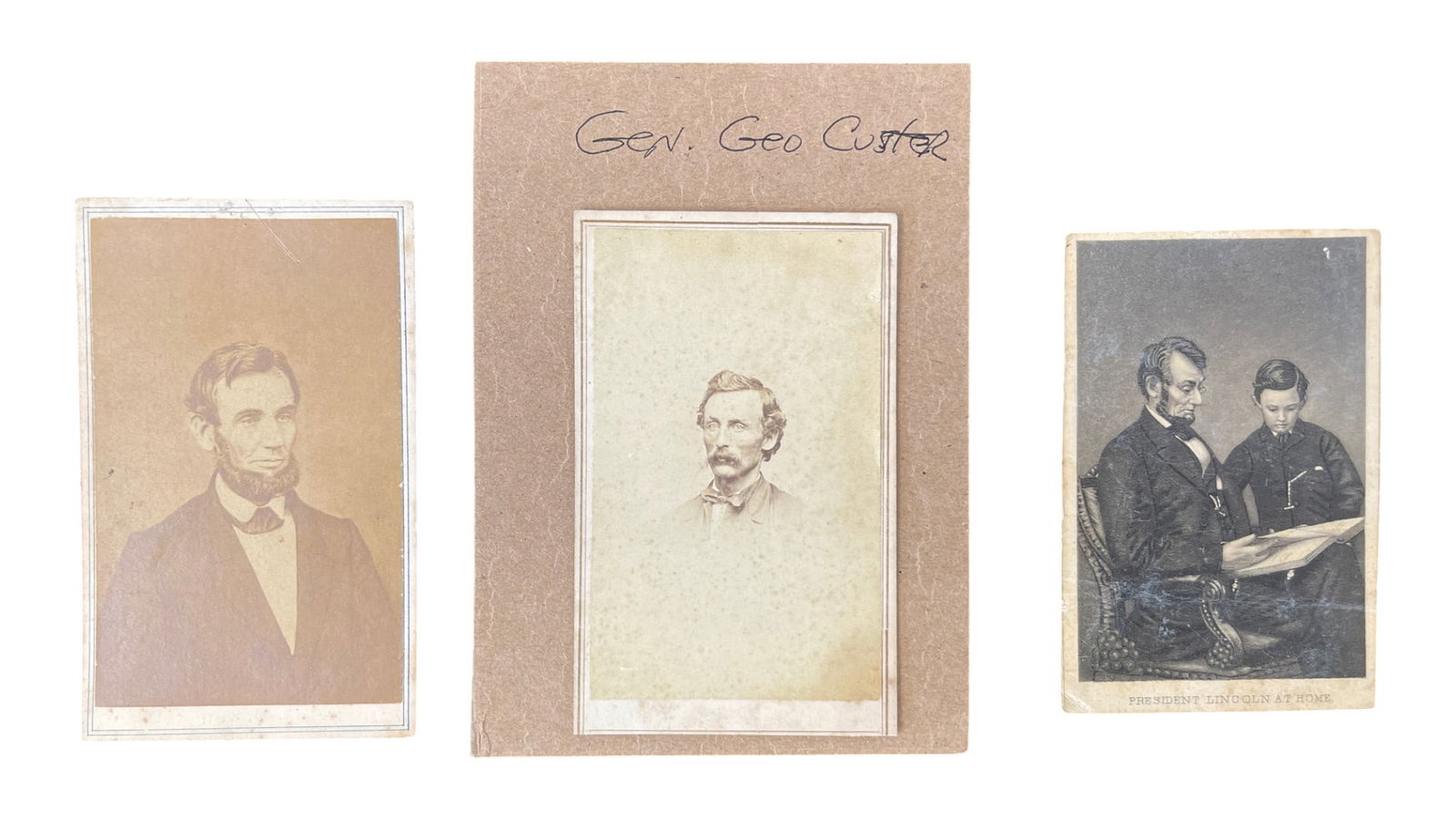 Group of Three Antique Lincoln and Custer Portrait Cards: Small group of three antique portrait cards featuring Abraham Lincoln, a center portrait identified in handwriting as “Gen. Geo Custer,” and a printed “President Lincoln at Home”