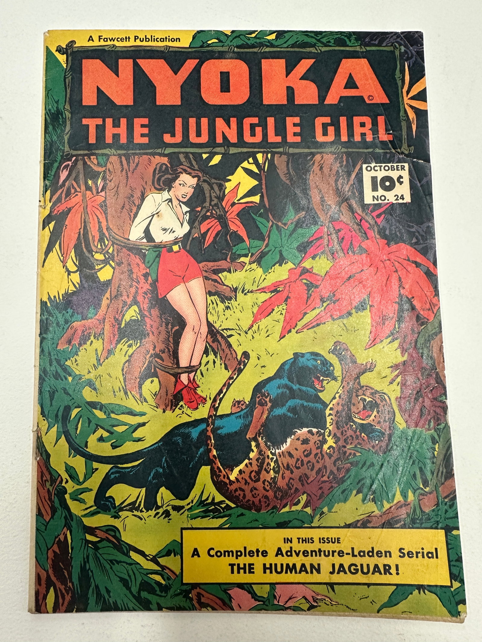 Nyoka The Jungle Girl #24, Fawcett Publications, October 1948: Nyoka the Jungle Girl #24, published by Fawcett Publications, cover dated October 1948, priced at 10 cents. This issue features a dramatic jungle cover scene depicting Nyoka alongside a leopard and bl