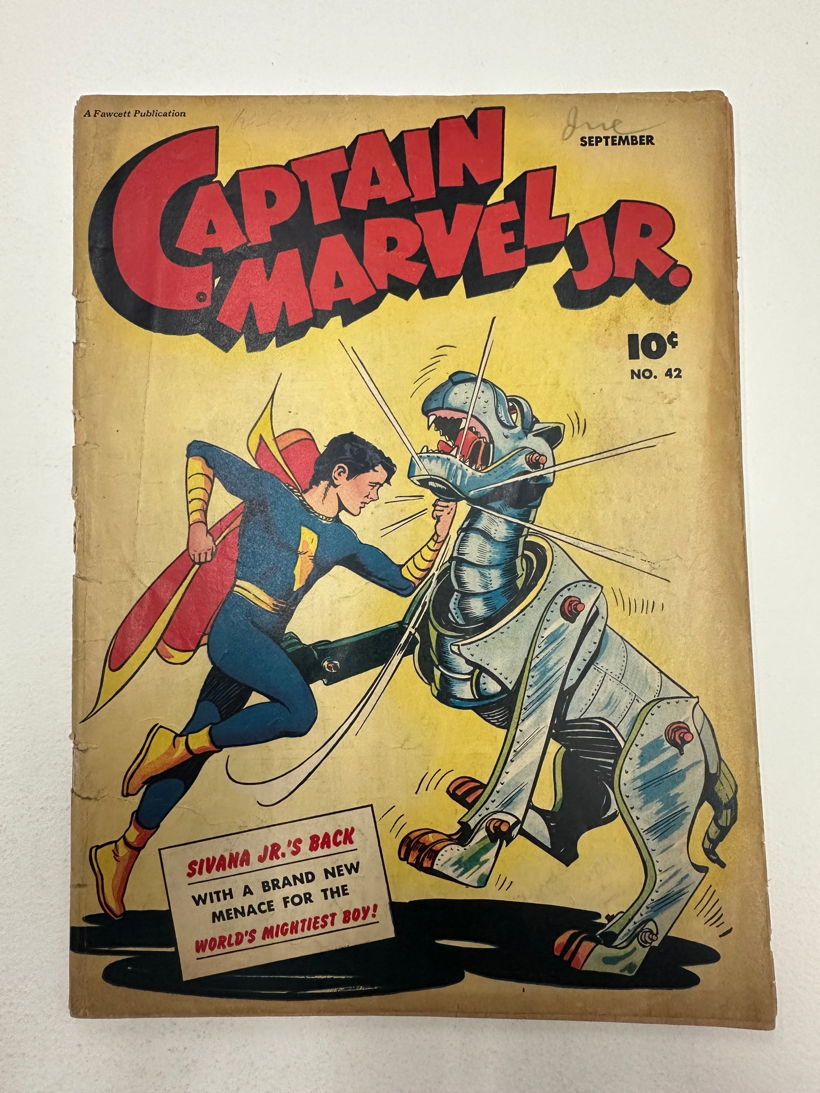 Captain Marvel Jr. #42 Fawcett Publications Sept 1946 Golden Age Comic: Captain Marvel Jr. #42, published by Fawcett Publications and dated September 1946, is a Golden Age superhero comic featuring the character Freddy Freeman as Captain Marvel Jr. The cover prominently d