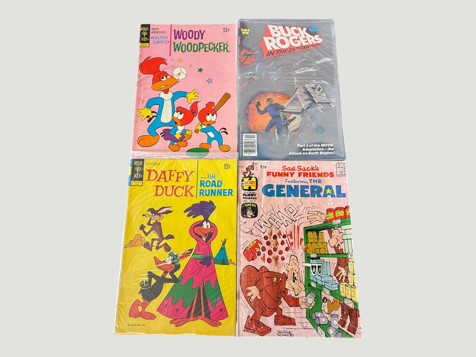 Lot of 4 Vintage Comics: Woody Woodpecker, Buck Rogers, Daffy Duck, Sad Sack (1 of 2)