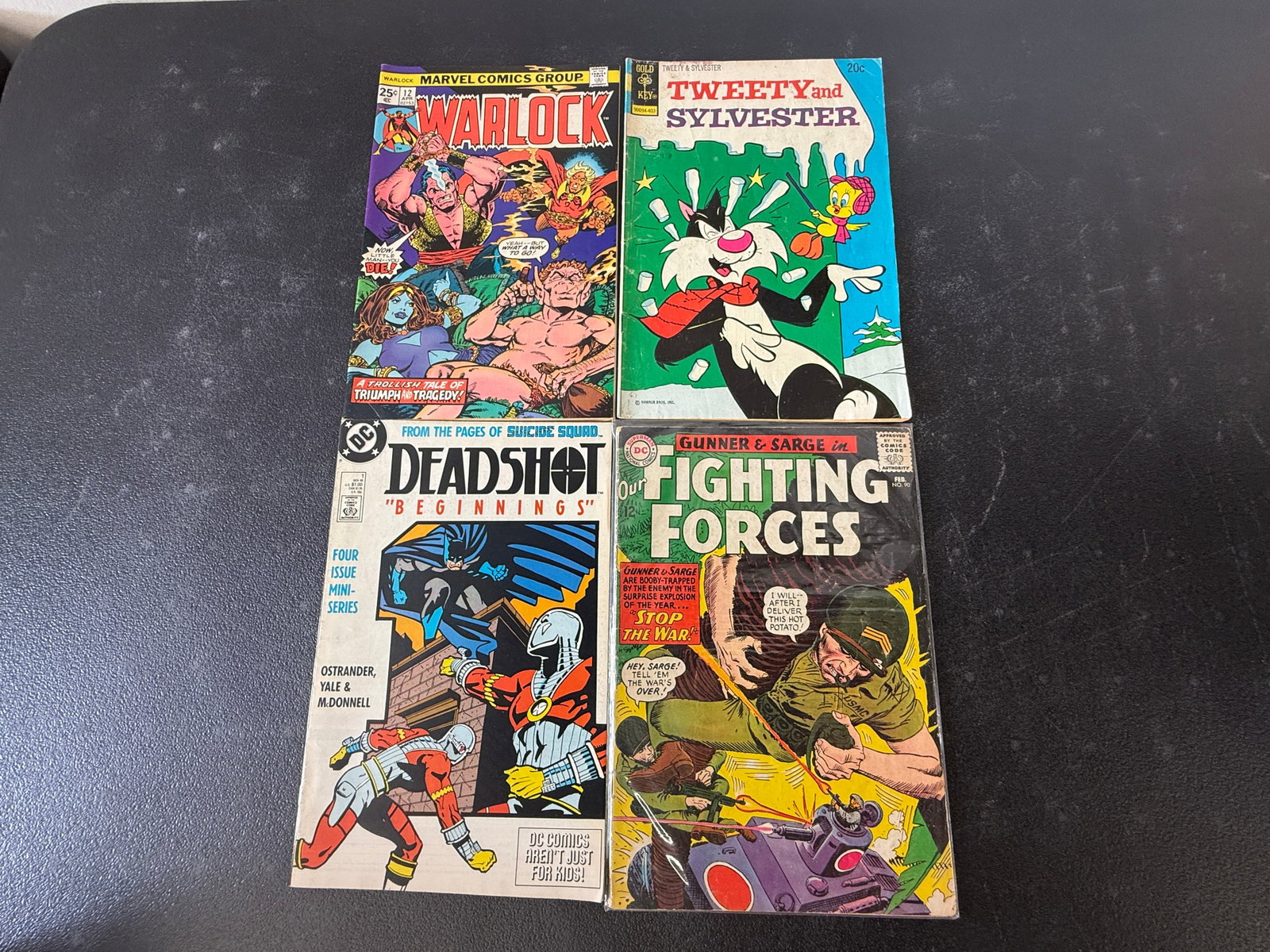 Lot of 4 Vintage Comics: Warlock #12, Tweety & Sylvester, Deadshot #1, Fighting Forces (1 of 2)