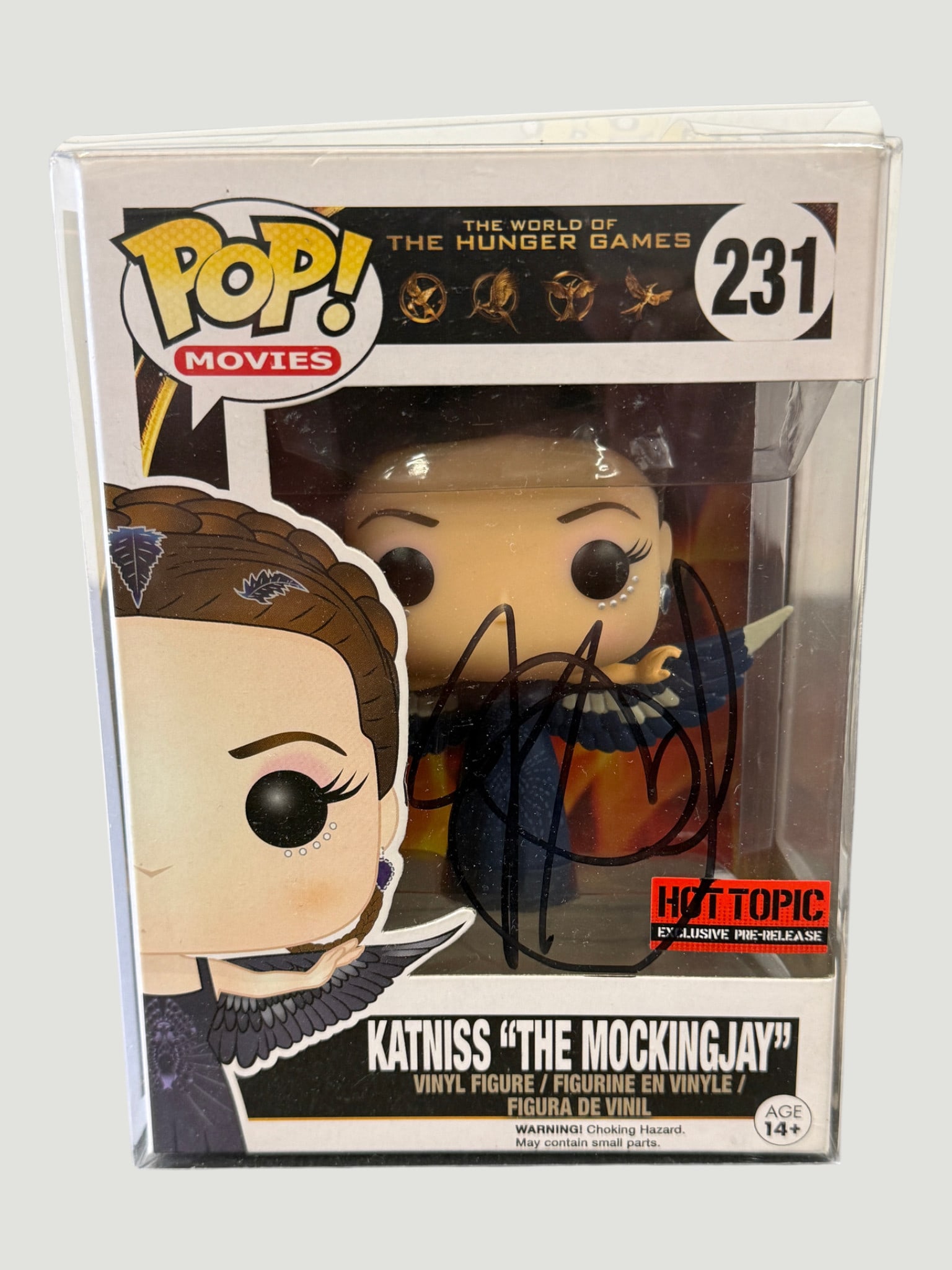 Funko Pop! Movies #231 Katniss 'The Mockingjay' Hot Topic Exclusive Pre-Release Signed: Funko Pop! Movies vinyl figure #231 depicting Katniss Everdeen as 'The Mockingjay' from The World of The Hunger Games franchise, released circa 2015. This is a Hot Topic Exclusive Pre-Release edition,
