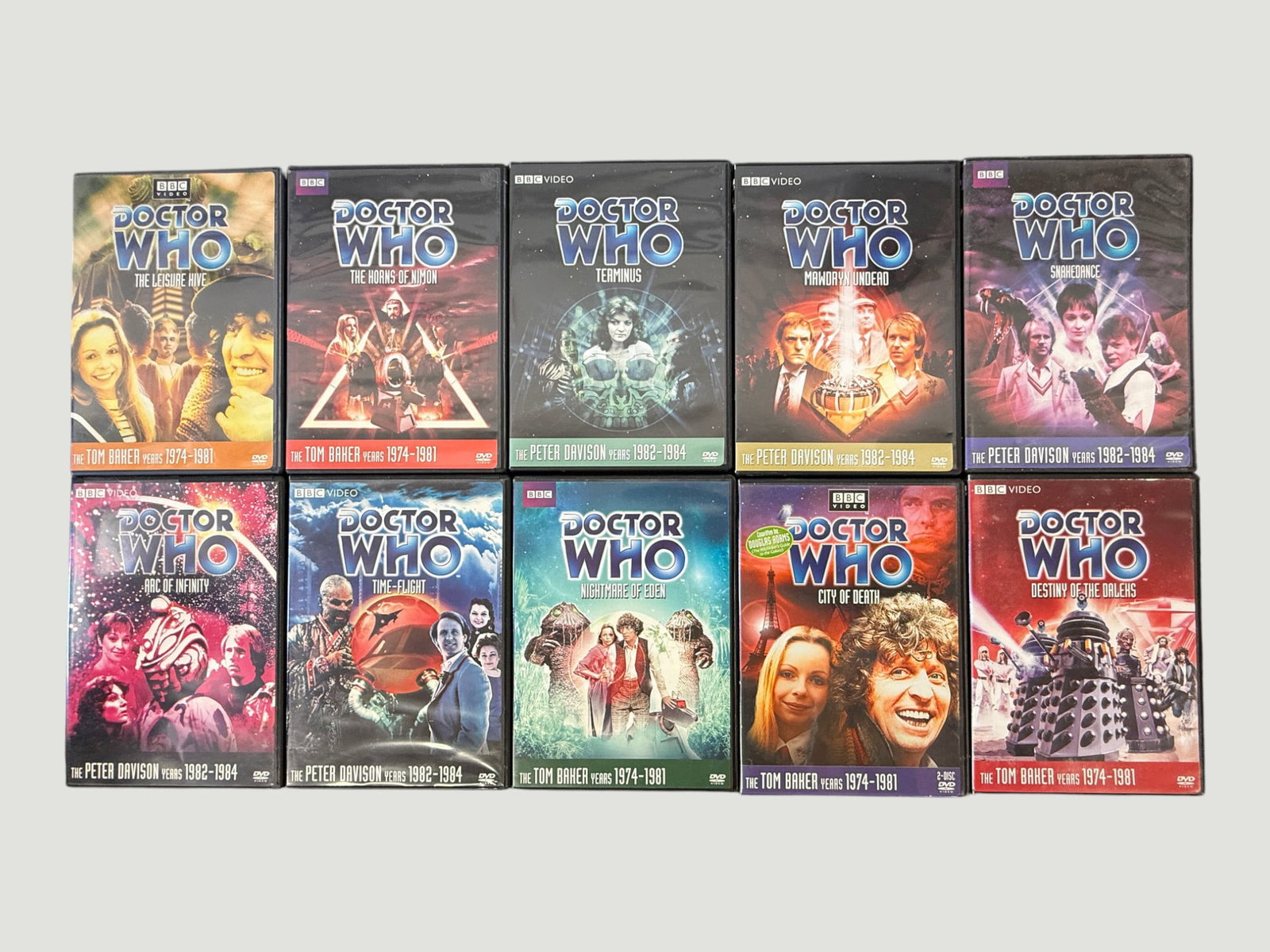 Doctor Who BBC Video DVD Collection x10 - Tom Baker & Peter Davison Era Stories: A collection of ten Doctor Who BBC Video DVDs comprising stories from the Tom Baker years (1974–1981) and Peter Davison years (1982–1984). Tom Baker titles include: The Leisure Hive, The Horns of 