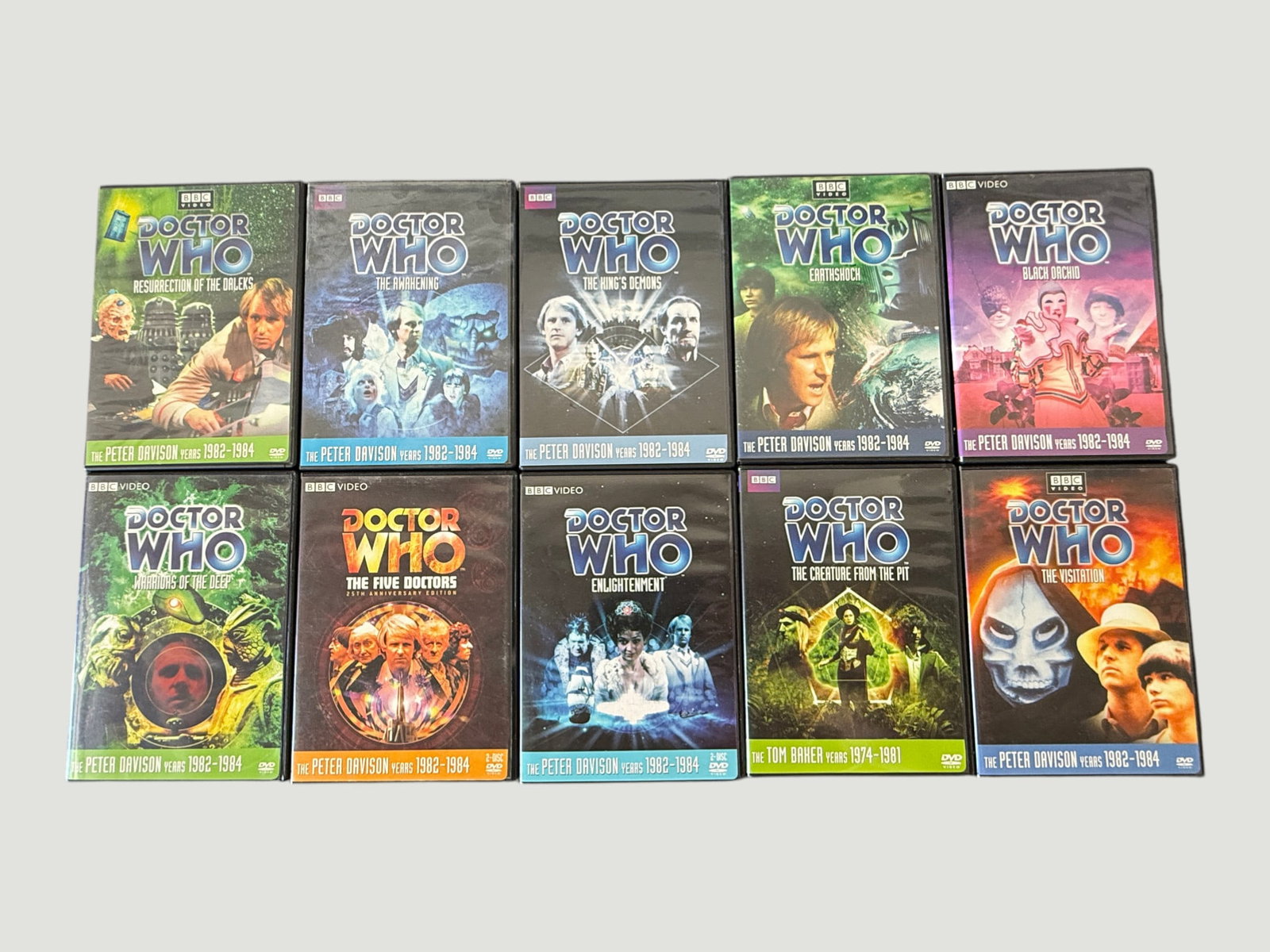 Doctor Who BBC Video DVD Collection x10 – Peter Davison Era Classic Stories: A collection of ten Doctor Who BBC Video DVDs, predominantly from the Peter Davison Years 1982–1984 era, including notable stories such as Resurrection of the Daleks, The Awakening, The King's Demon