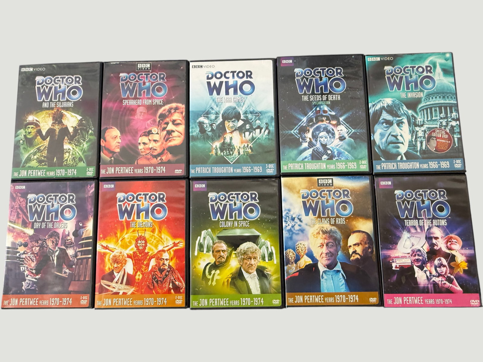 Doctor Who Classic BBC DVD Collection x10 — Pertwee & Troughton Eras: A collection of ten BBC Doctor Who DVD releases spanning the Patrick Troughton years (1966–1969) and the Jon Pertwee years (1970–1974). Titles include 'The War Games' (3-disc), 'Spearhead from Spa