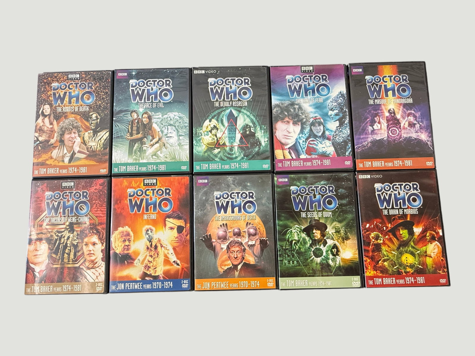 Doctor Who Classic BBC DVD Collection x10 — Tom Baker & Jon Pertwee Era Stories: A collection of ten Doctor Who classic series DVD releases from BBC Video, spanning the Jon Pertwee years (1970–1974) and the Tom Baker years (1974–1981). Titles included are: The Robots of Death,