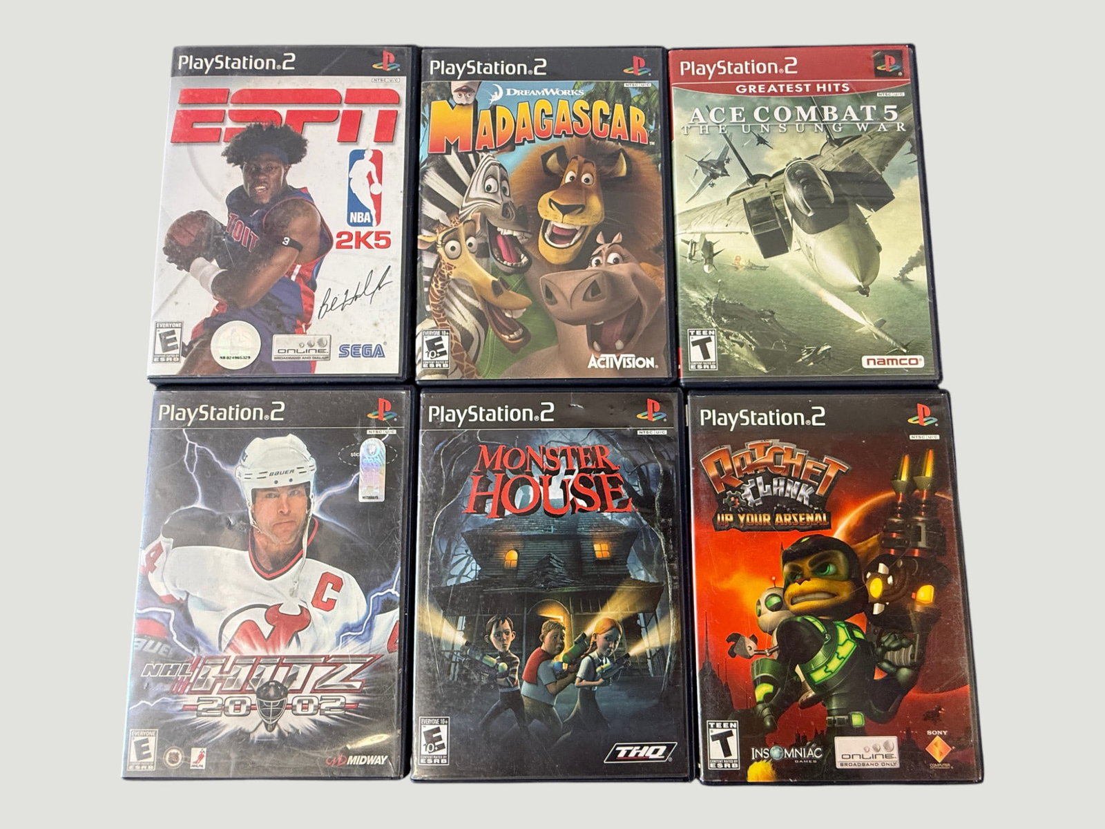 PlayStation 2 Games Lot x6 — NBA 2K5, Madagascar, Ace Combat 5, NHL Blitz, Monster House, Ratchet (1 of 2)