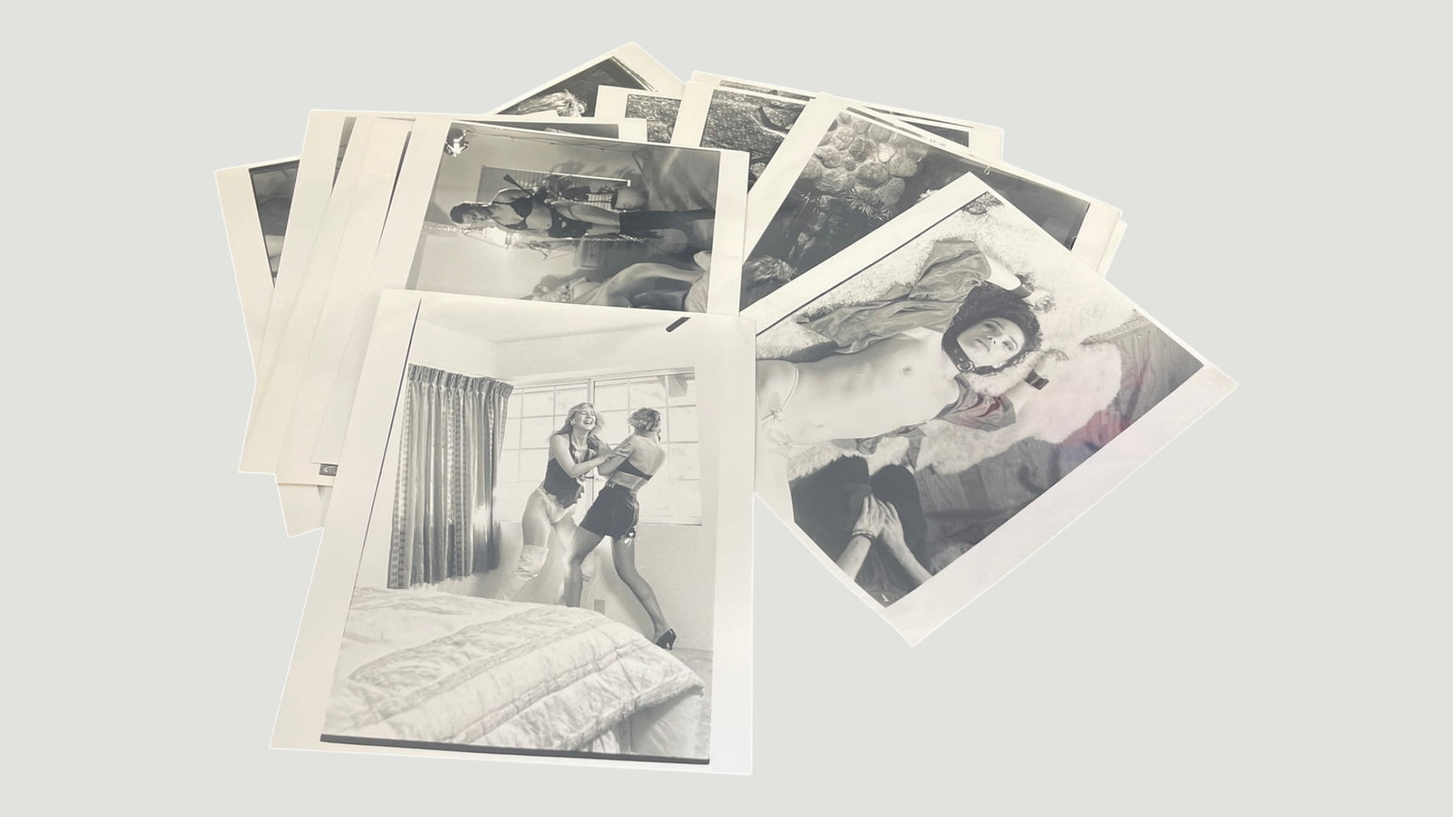 Vintage Black & White Glamour/Boudoir Photography Prints, Collection of ~15: A collection of approximately 15 black and white photographic prints depicting glamour and boudoir-style photography, likely from the 1960s–1980s era. The prints feature female subjects in lingerie 